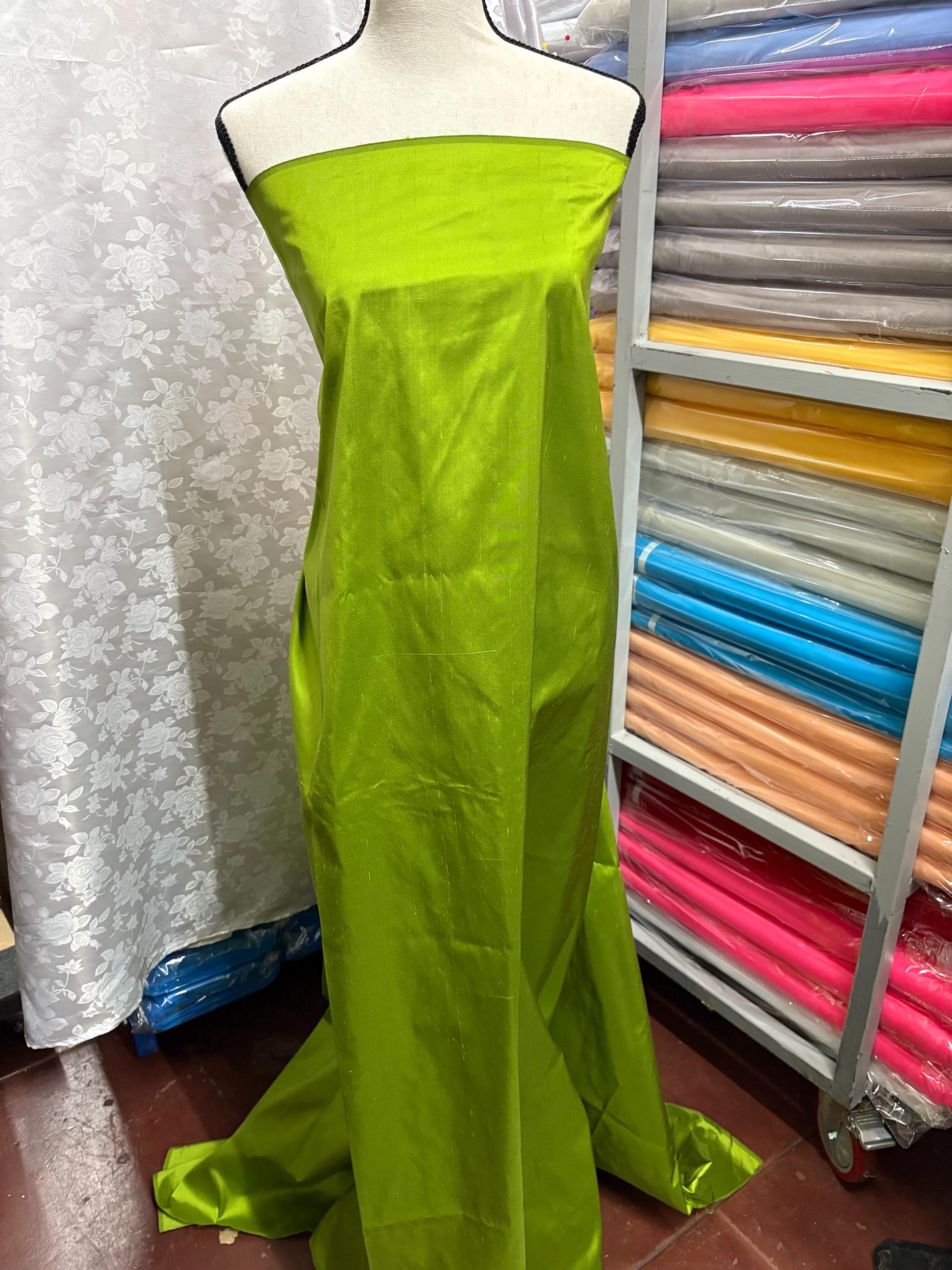 100% silk Dupioni Taffeta width 54" color is Lt.Olive. Machine made, fabric has slubs. Item # 4. free sample.