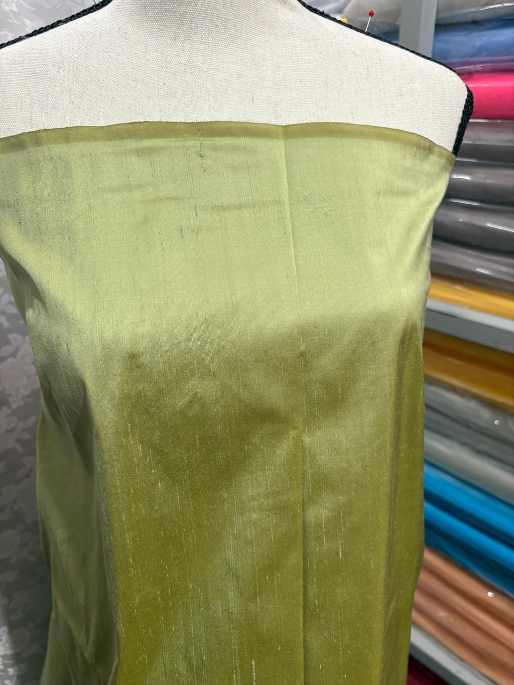 100% silk Dupioni Taffeta width 54" color is Lt. Sage. Machine made, fabric has slubs. Item # 5. free sample.