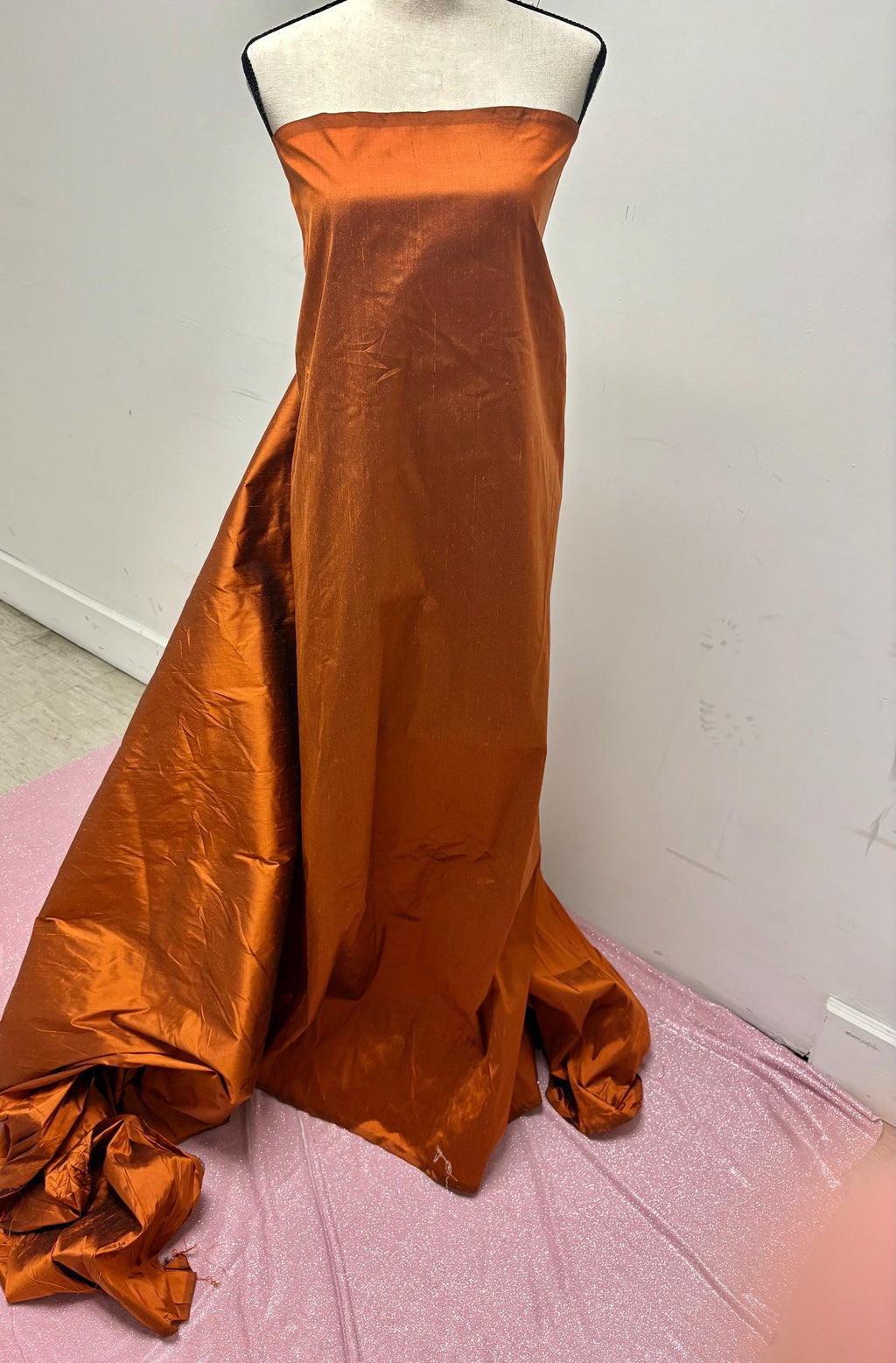 100% silk Dupioni Taffeta width 54" color is Rust with black warp. Machine made, fabric has slubs. free sample. Nas2224-B (dark shade)