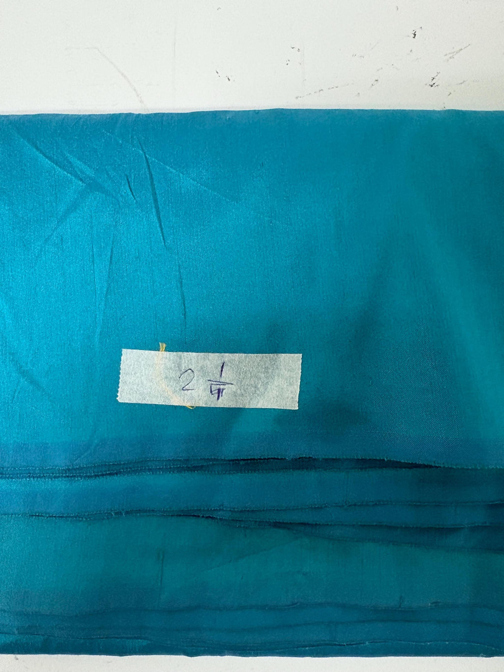 100% silk Dupioni Taffeta width 54" color is Turquoise. Machine made, fabric has slubs. Item # 10. free sample.