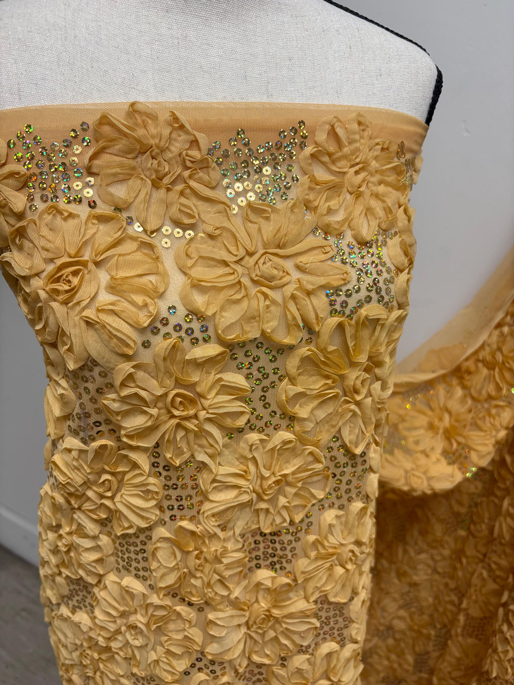 Chiffon ribbon mesh fabric color gold with sequence. sells by yard.