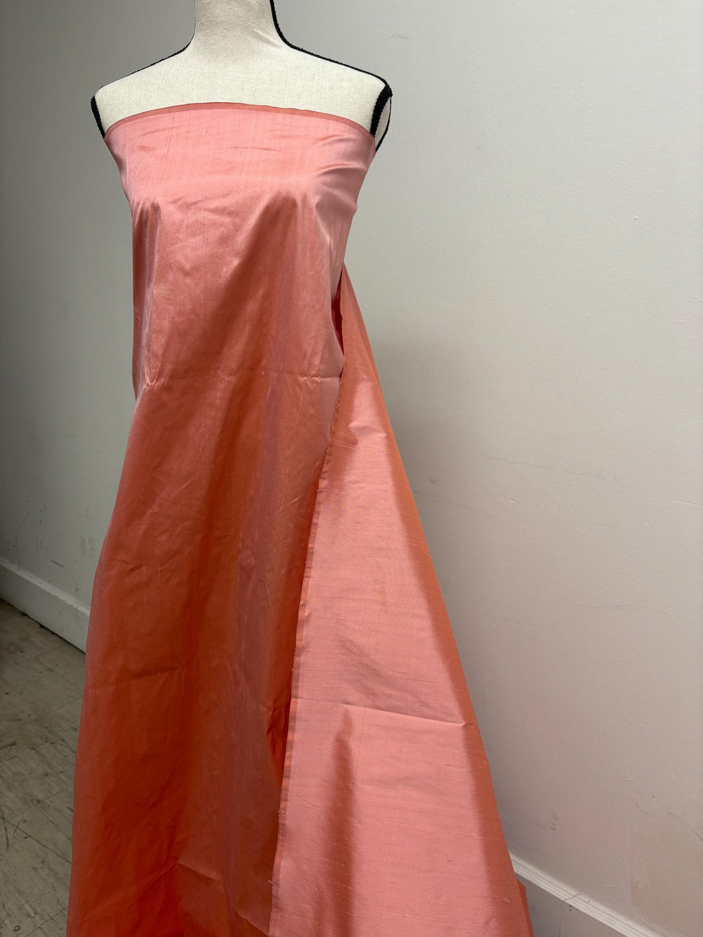 100% silk Dupioni Taffeta width 54" color is Coral. Machine made, fabric has slubs. Item # 12. free sample.