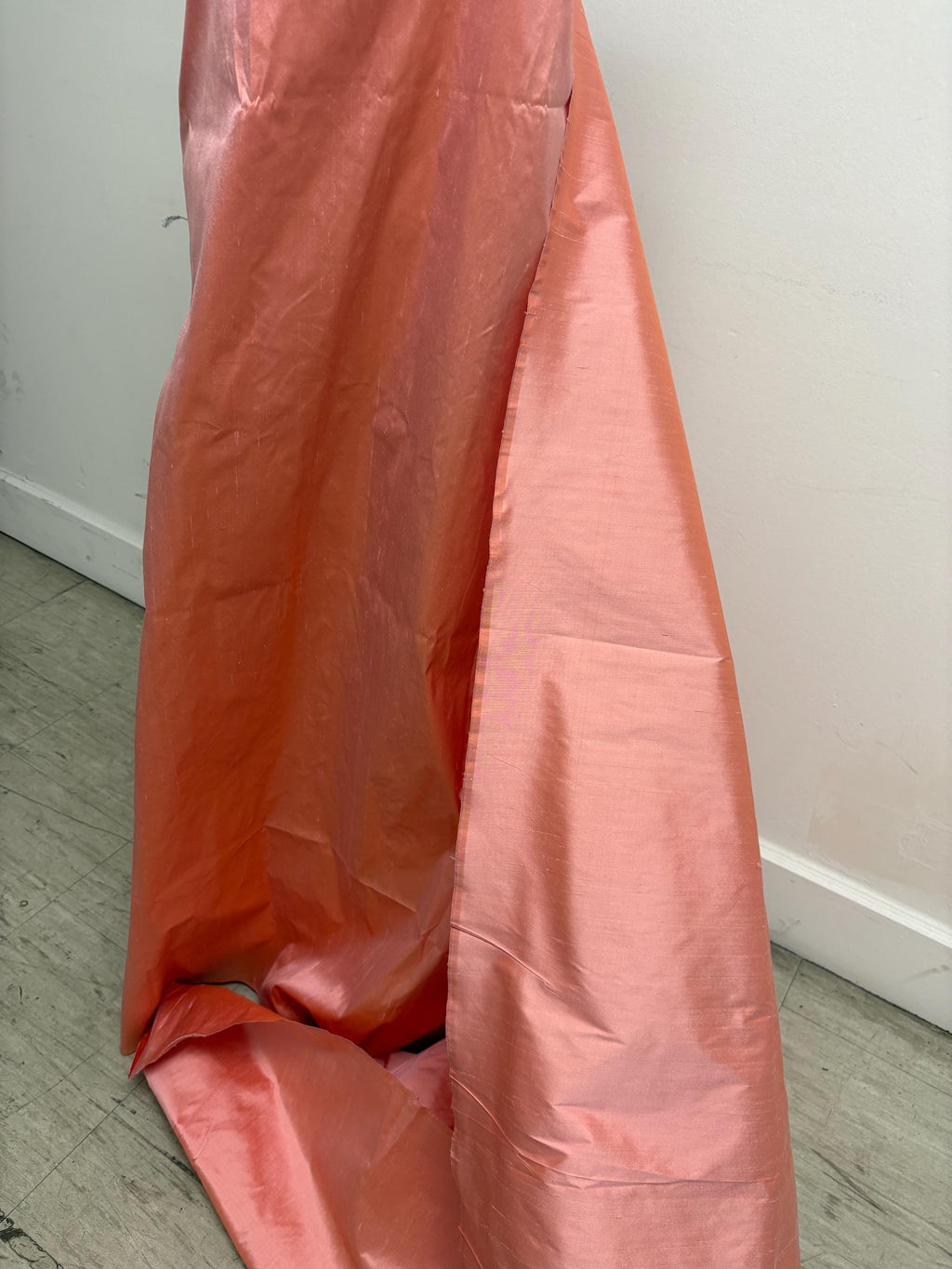 100% silk Dupioni Taffeta width 54" color is Coral. Machine made, fabric has slubs. Item # 12. free sample.