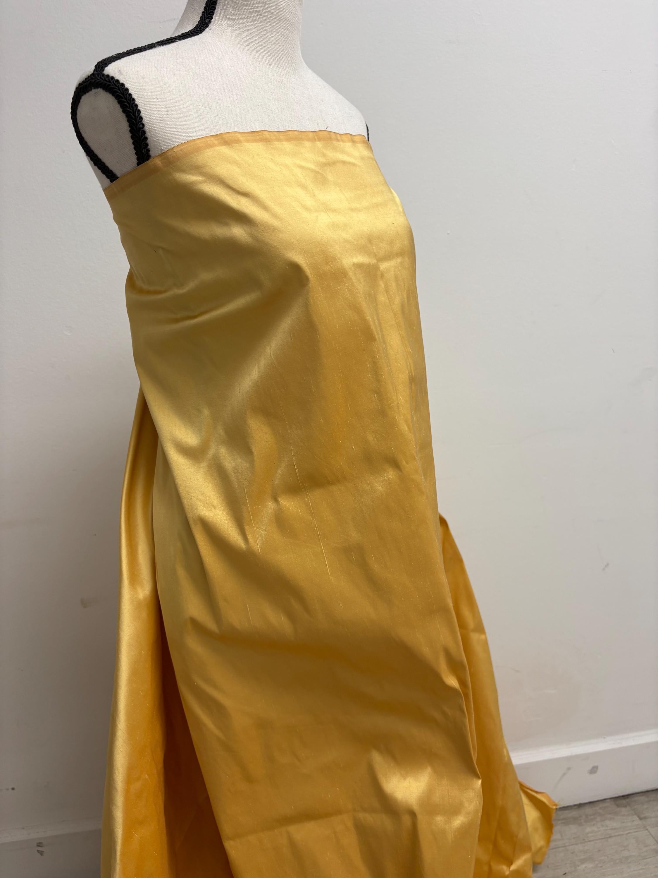100% silk Dupioni Taffeta width 54" color is Gold 2209. Machine made, fabric has slubs. free sample. shop with confidence.