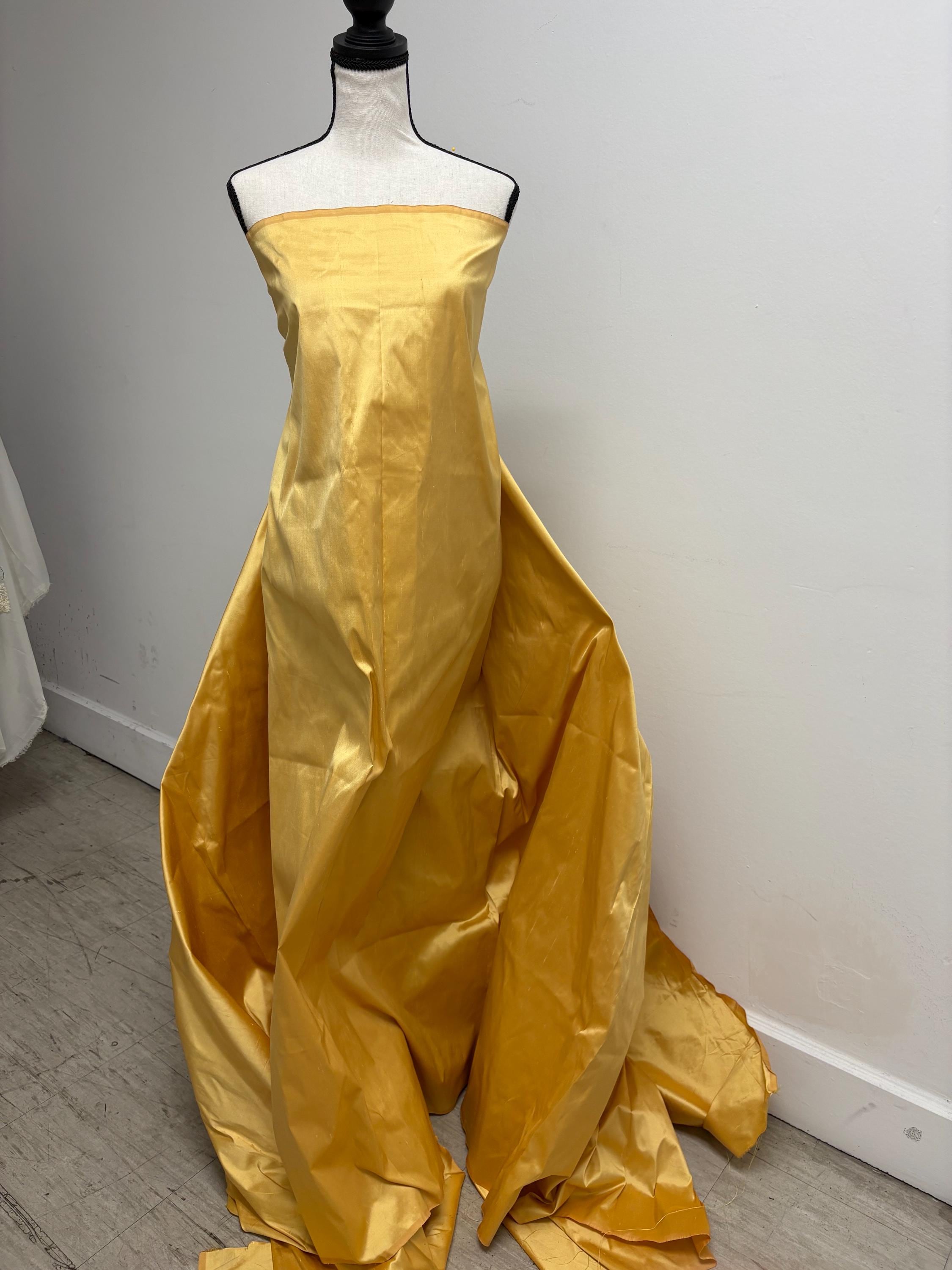 100% silk Dupioni Taffeta width 54" color is Gold 2209. Machine made, fabric has slubs. free sample. shop with confidence.