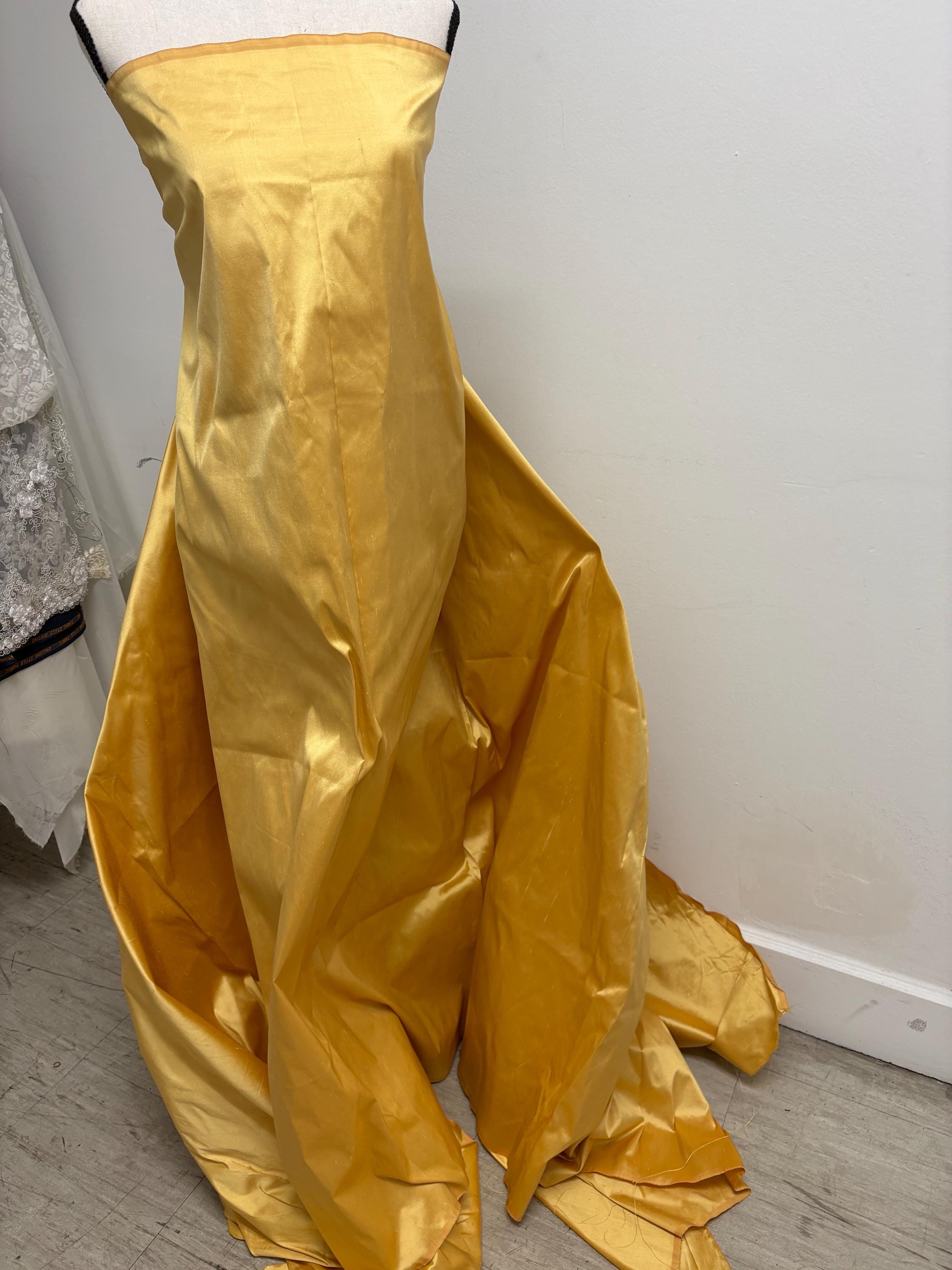 100% silk Dupioni Taffeta width 54" color is Gold 2209. Machine made, fabric has slubs. free sample. shop with confidence.