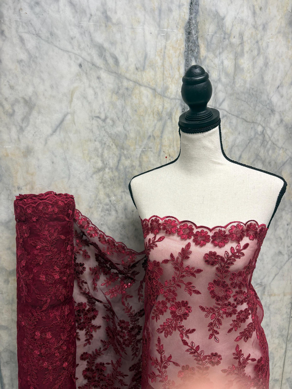 Burgundy Lace fabric design bloom 6 width 49". Double scalloped embroidery sequence.