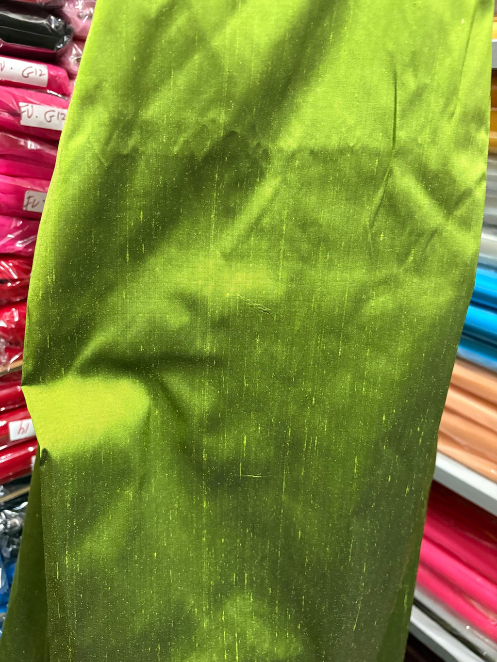 100% silk Dupioni Taffeta width 54" color is two tone Olive with black tone. Machine made, fabric has slubs. Item # 3. free sample.