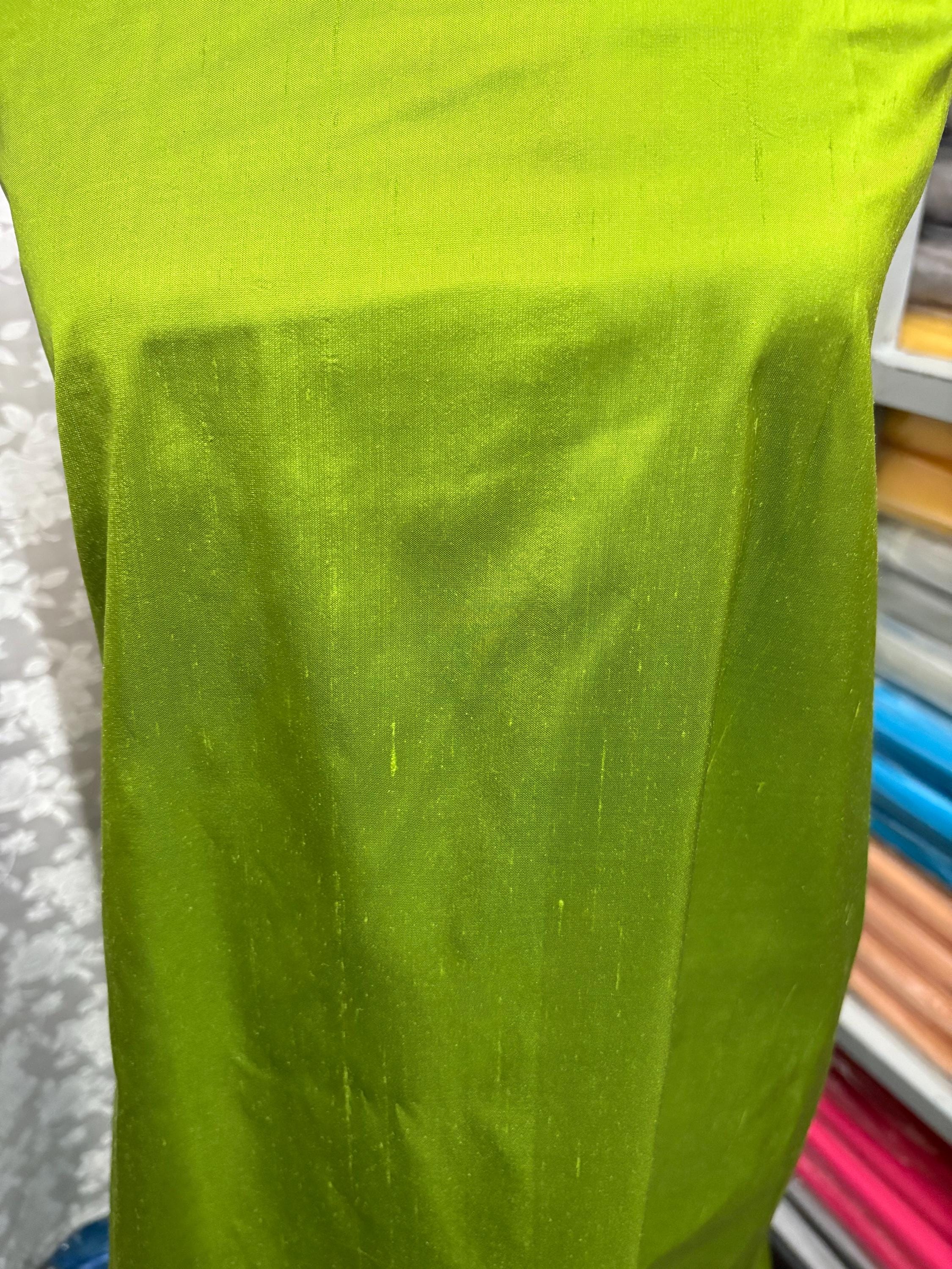 100% silk Dupioni Taffeta width 54" color is Lt.Olive. Machine made, fabric has slubs. Item # 4. free sample.