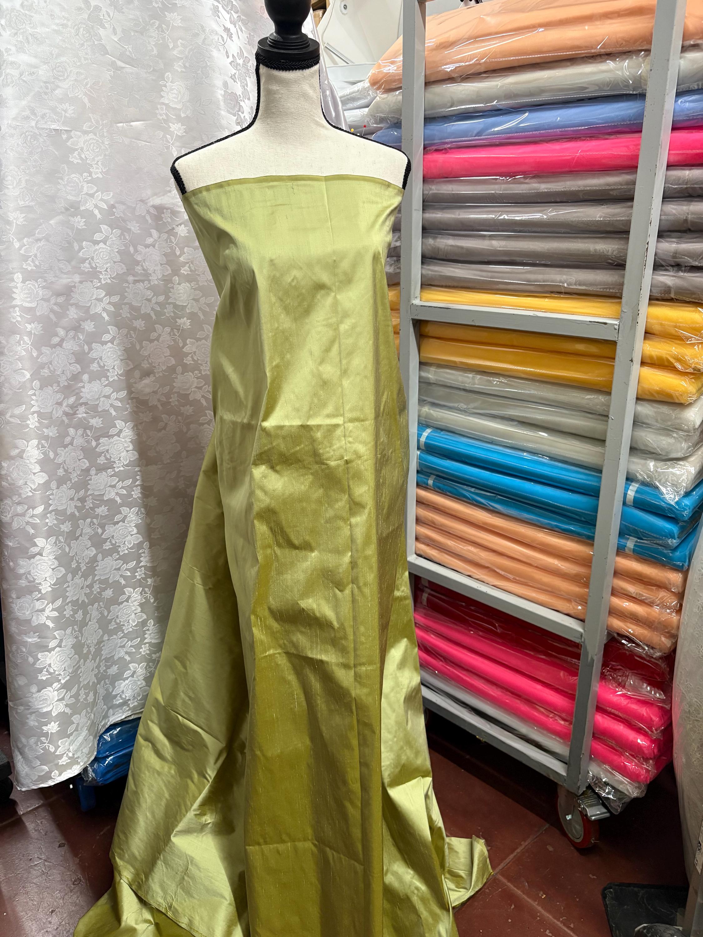 100% silk Dupioni Taffeta width 54" color is Lt. Sage. Machine made, fabric has slubs. Item # 5. free sample.