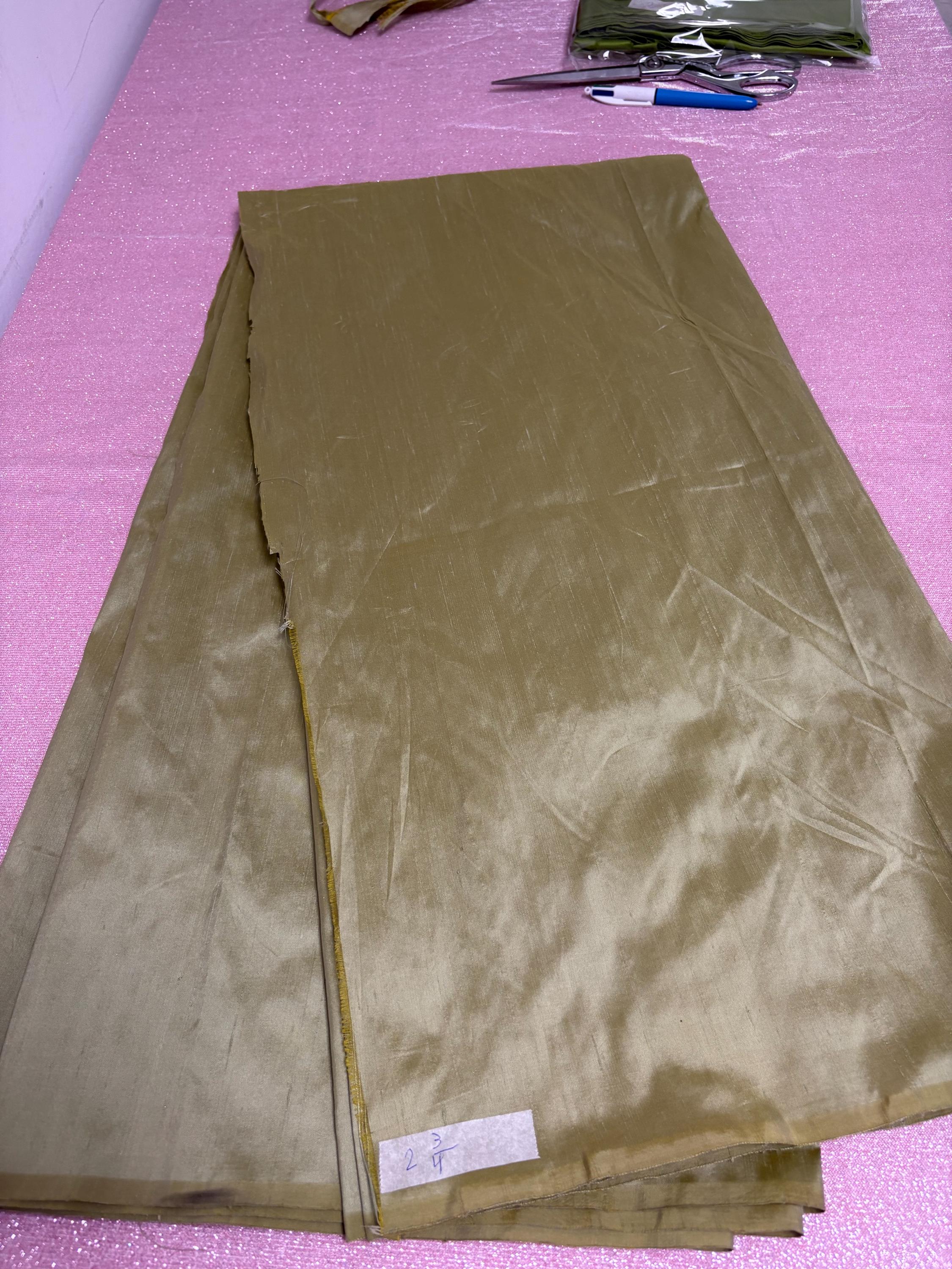 100% silk Dupioni Taffeta width 54" color is Lt. Sage. Machine made, fabric has slubs. Item # 5. free sample.