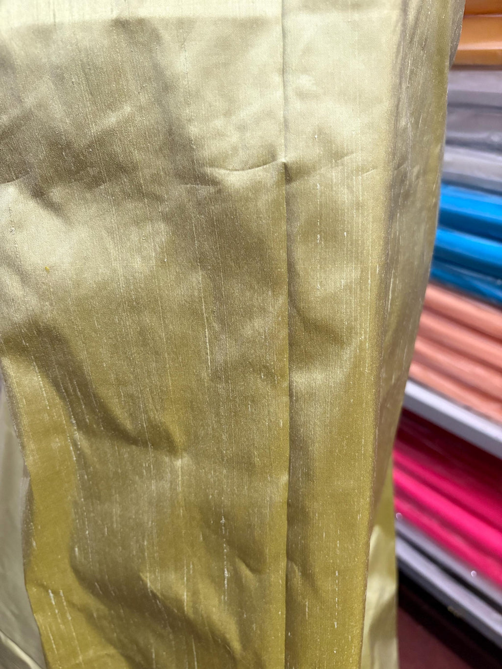 100% silk Dupioni Taffeta width 54" color is Lt. Sage. Machine made, fabric has slubs. Item # 5. free sample.