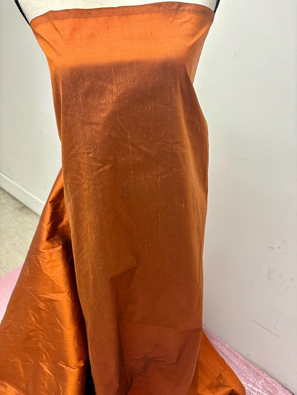 100% silk Dupioni Taffeta width 54" color is Rust with black warp. Machine made, fabric has slubs. Item # 8. free sample. Nas2224-B