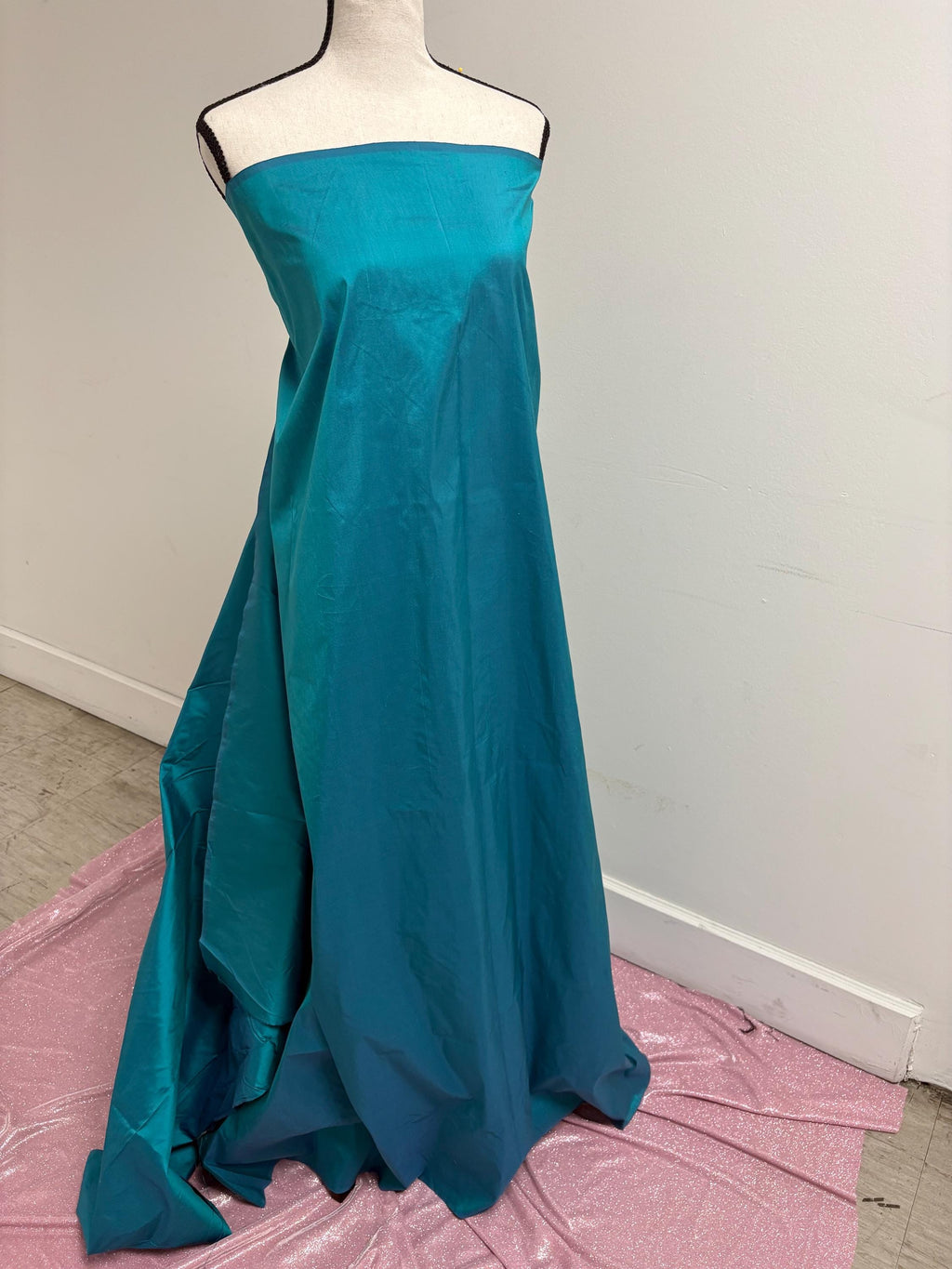 100% silk Dupioni Taffeta width 54" color is Turquoise. Machine made, fabric has slubs. Item # 10. free sample.