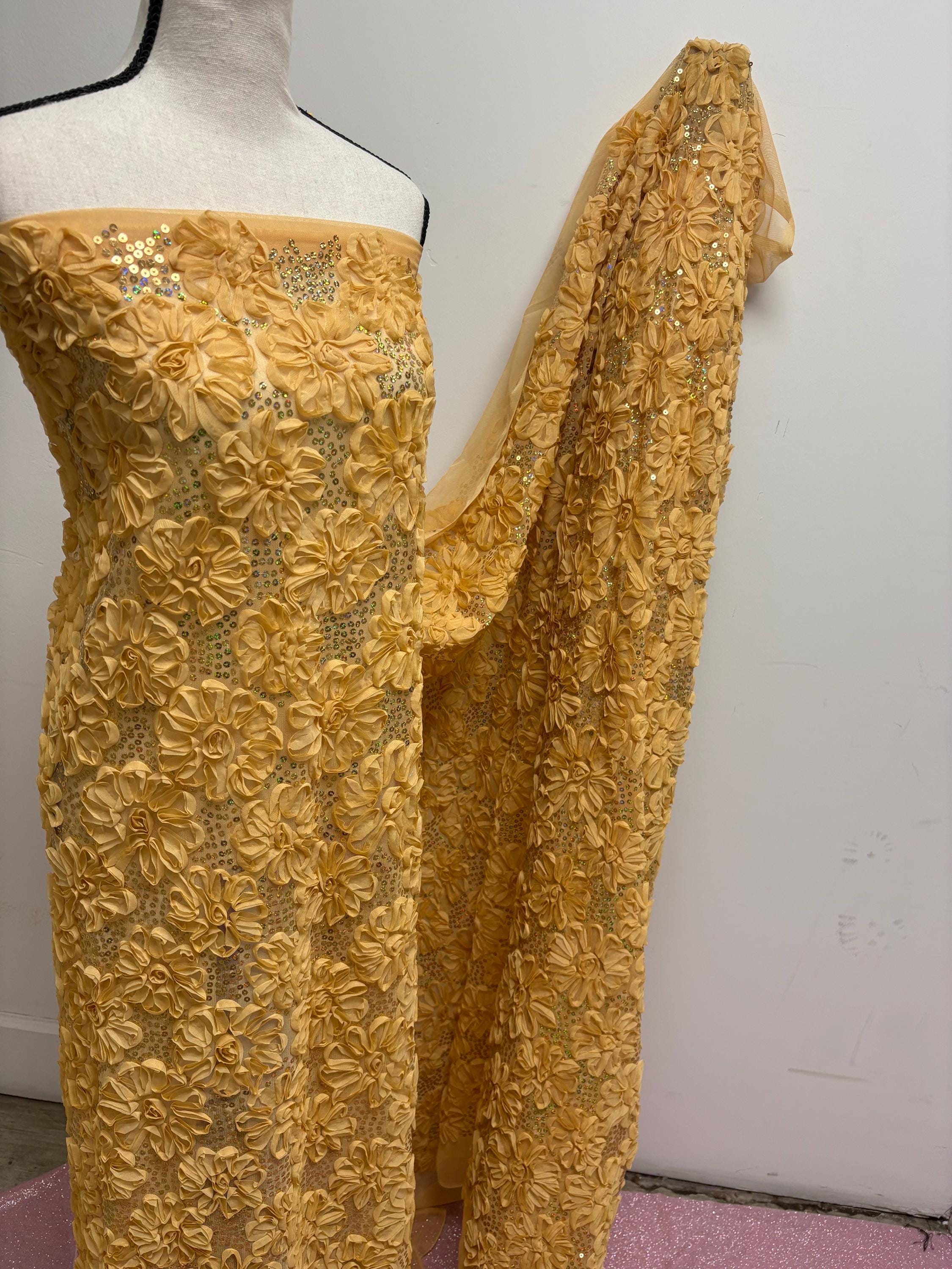 Chiffon ribbon mesh fabric color gold with sequence. sells by yard.