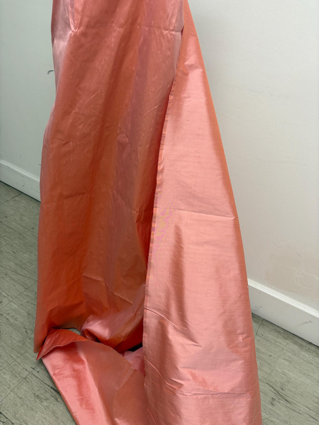 100% silk Dupioni Taffeta width 54" color is Coral. Machine made, fabric has slubs. Item # 12. free sample.