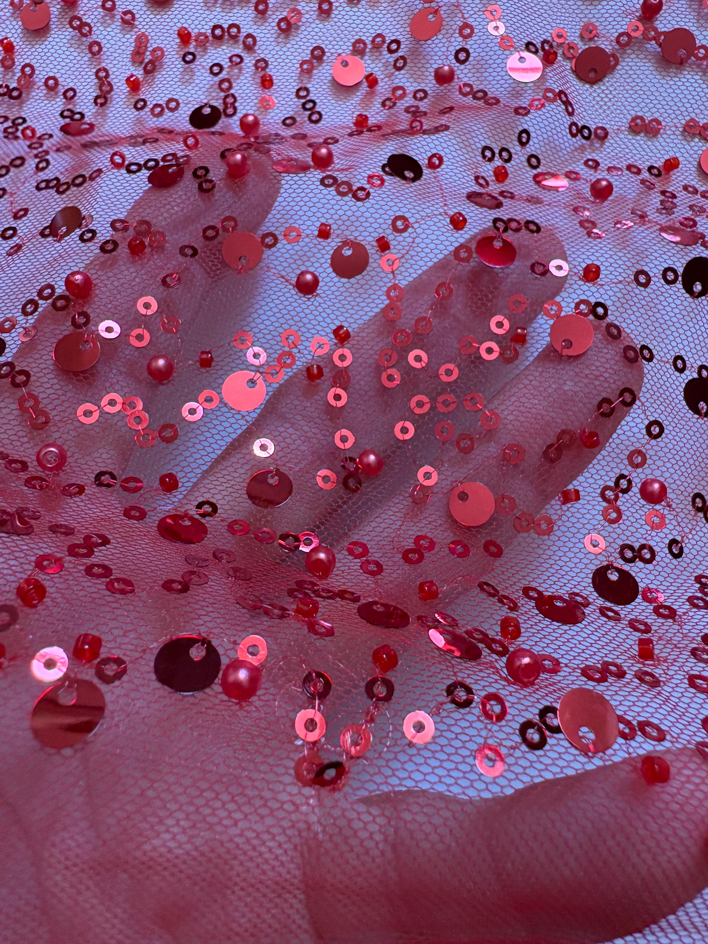 Red Beaded sequence mesh, width of sequence area is 50", plain mesh salvages on both end. item D8-NAS