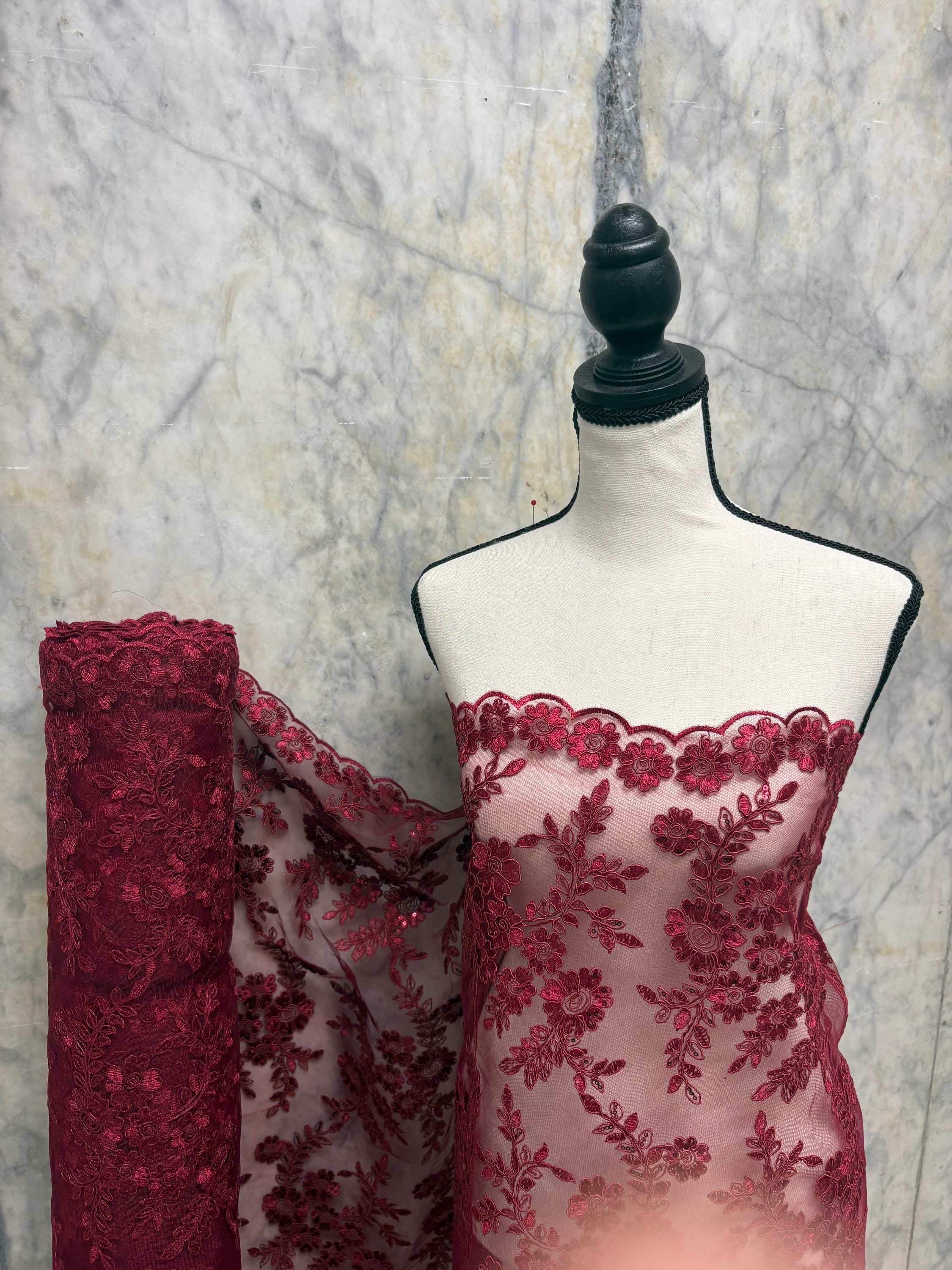 Burgundy Lace fabric design bloom 6 width 49". Double scalloped embroidery sequence.