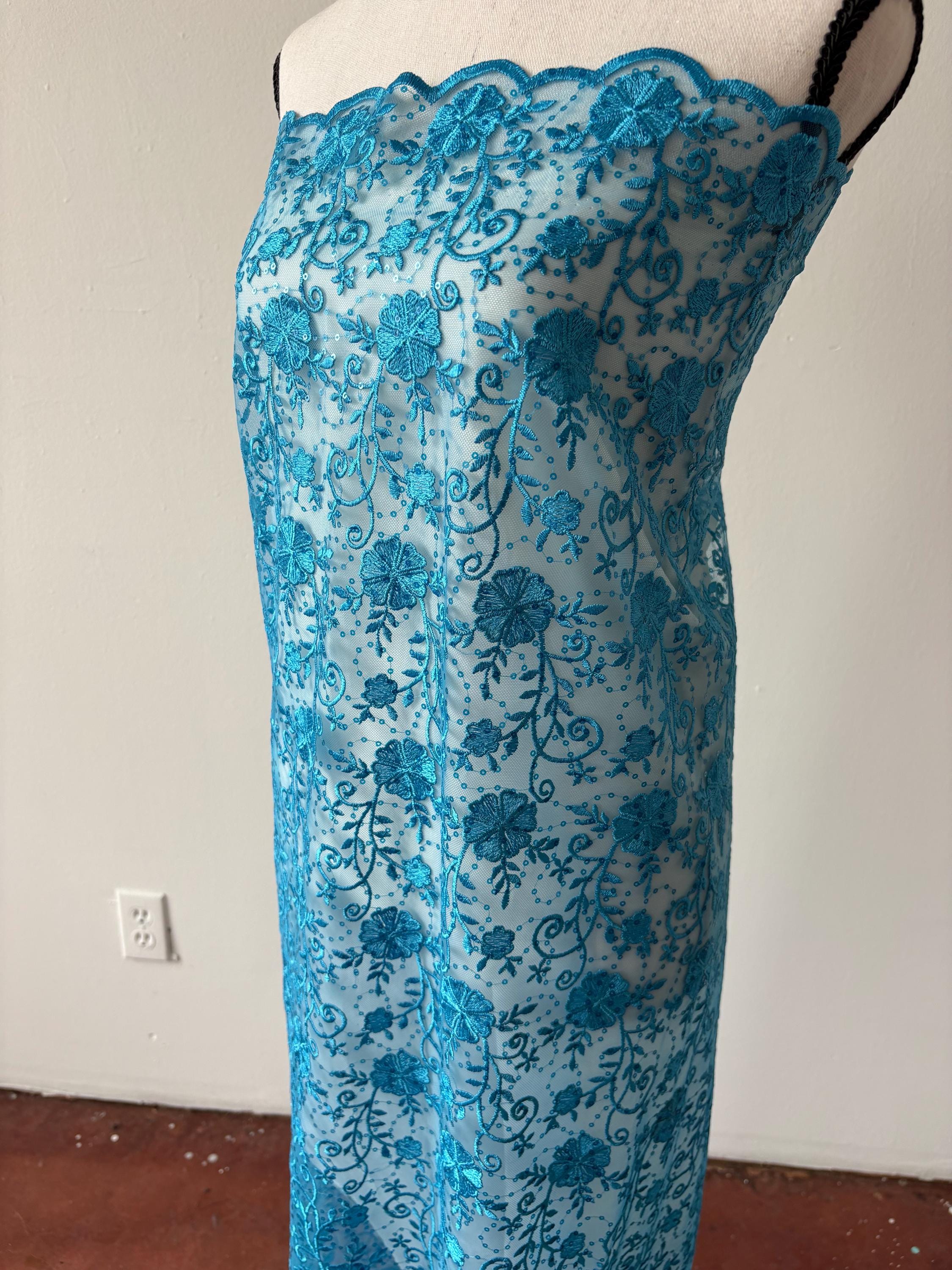 Turquoise lace fabric double scalloped embroidery sequence width 49". Design 04331279. shop with confidence ask fro free sample.