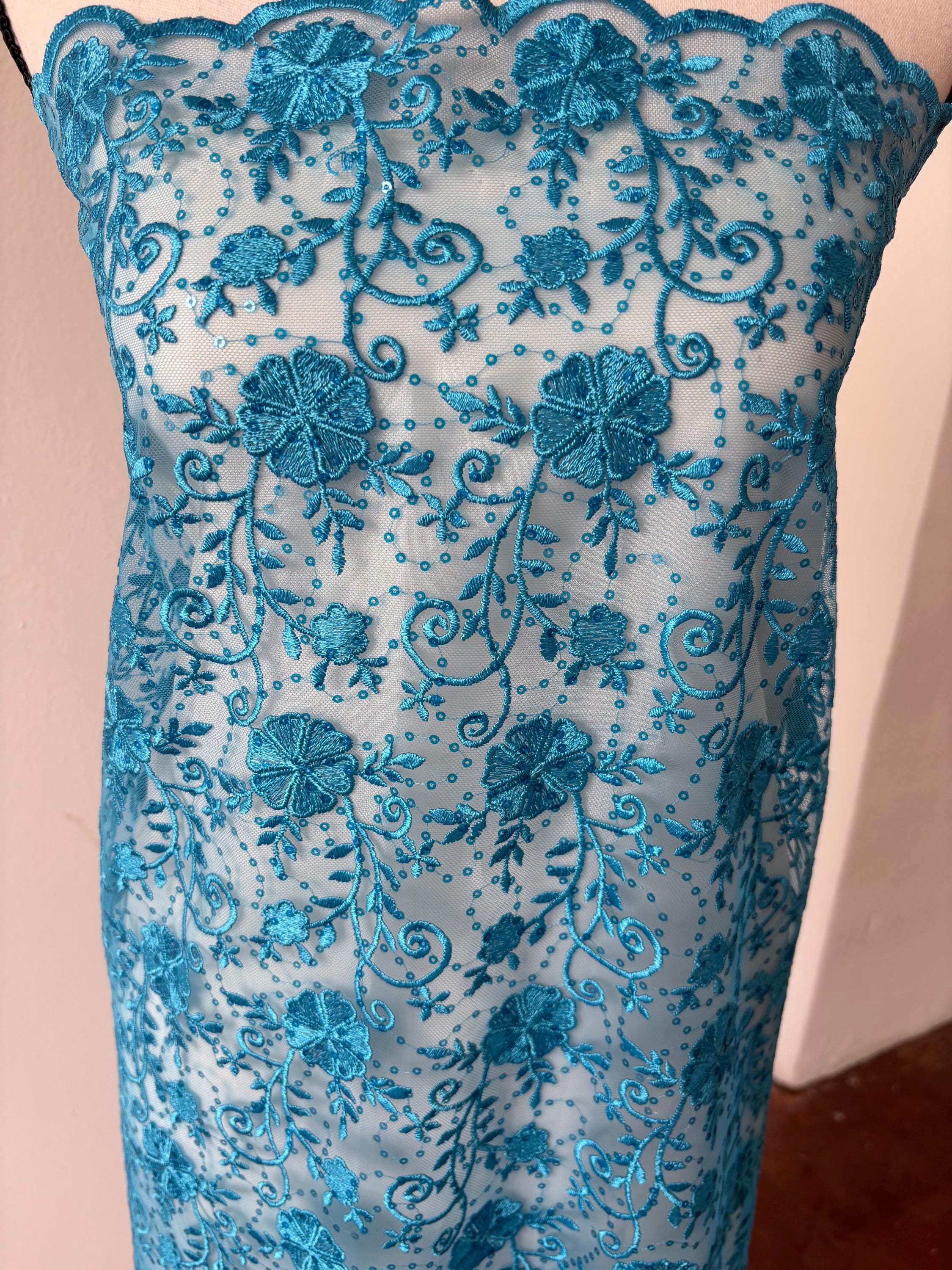 Turquoise lace fabric double scalloped embroidery sequence width 49". Design 04331279. shop with confidence ask fro free sample.