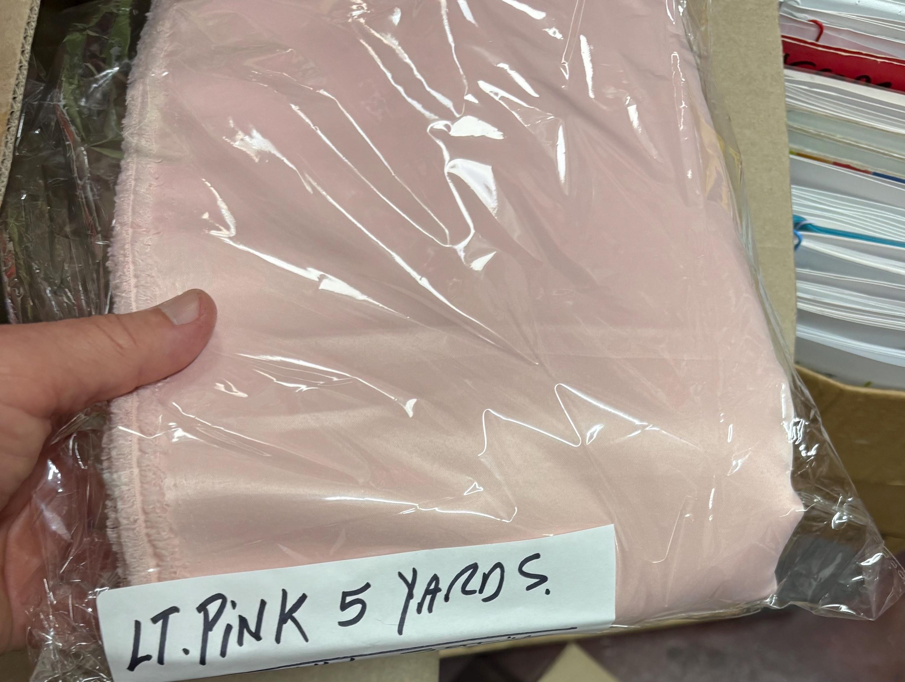 Light pink dull satin fabric, 58/60” wide, made of polyester – an excellent choice for gowns.
