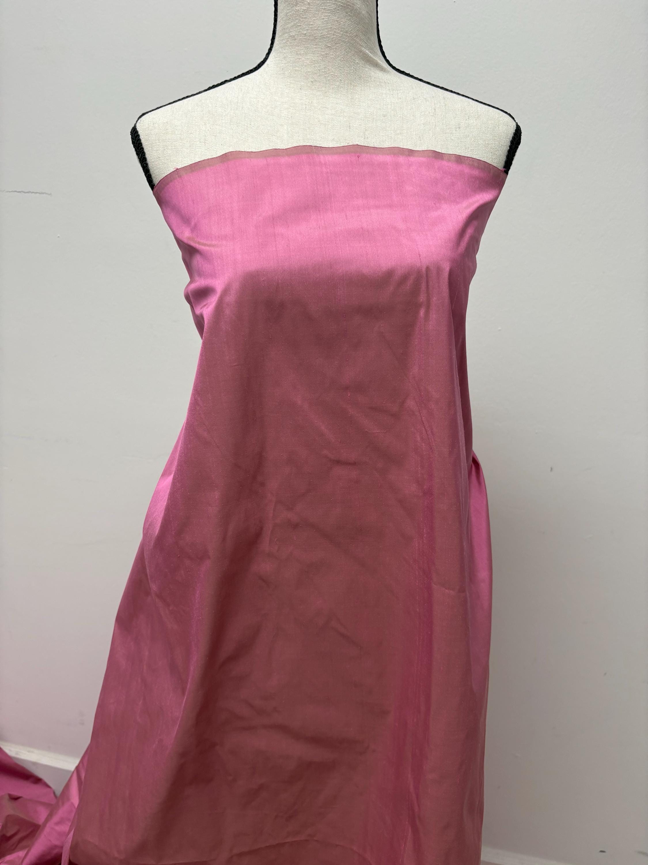 100% silk Dupioni Taffeta width 54" color Dusty Rose with green sheen. Fabric has slubbed. Check description. Item # 2259-2. NAS.