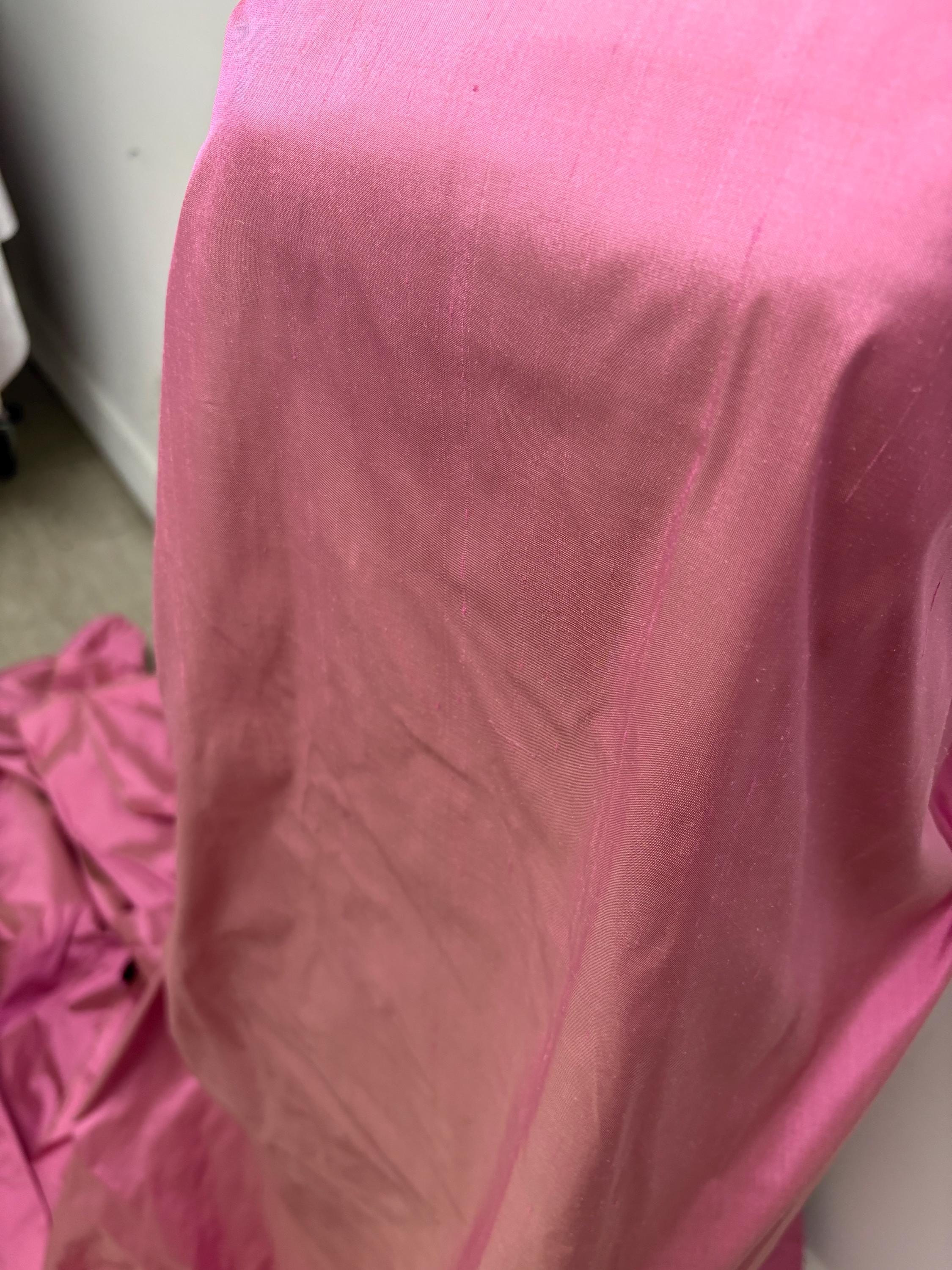 100% silk Dupioni Taffeta width 54" color Dusty Rose with green sheen. Fabric has slubbed. Check description. Item # 2259-2. NAS.