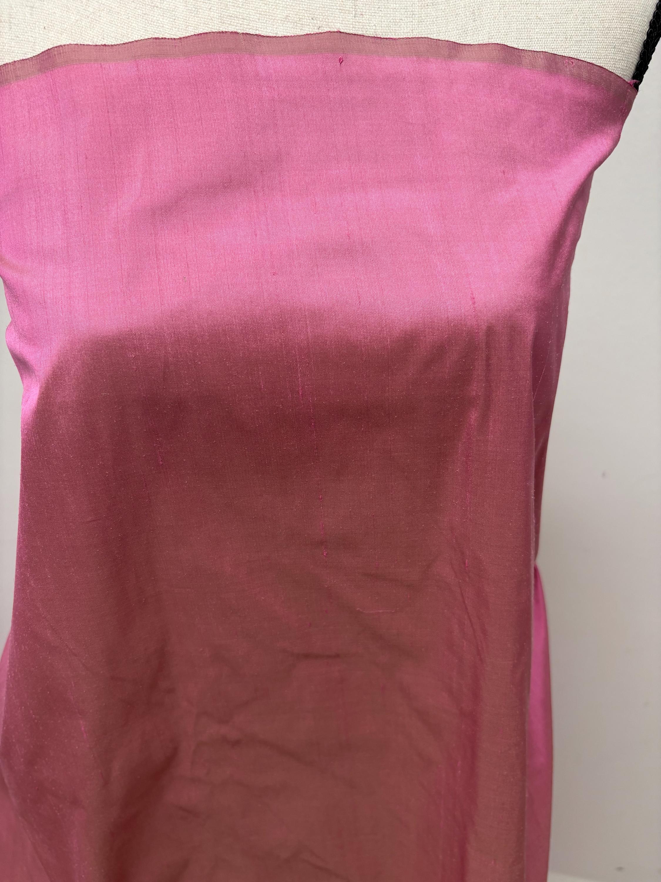 100% silk Dupioni Taffeta width 54" color Dusty Rose with green sheen. Fabric has slubbed. Check description. Item # 2259-2. NAS.