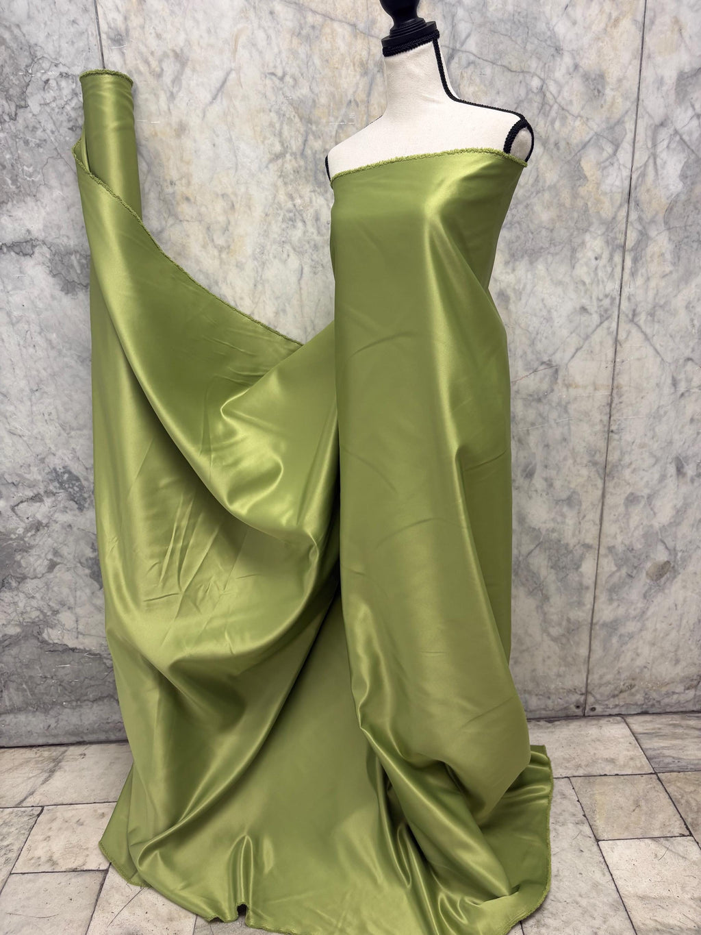 Green dull satin fabric, 58/60” wide, made of polyester – an excellent choice for gowns.