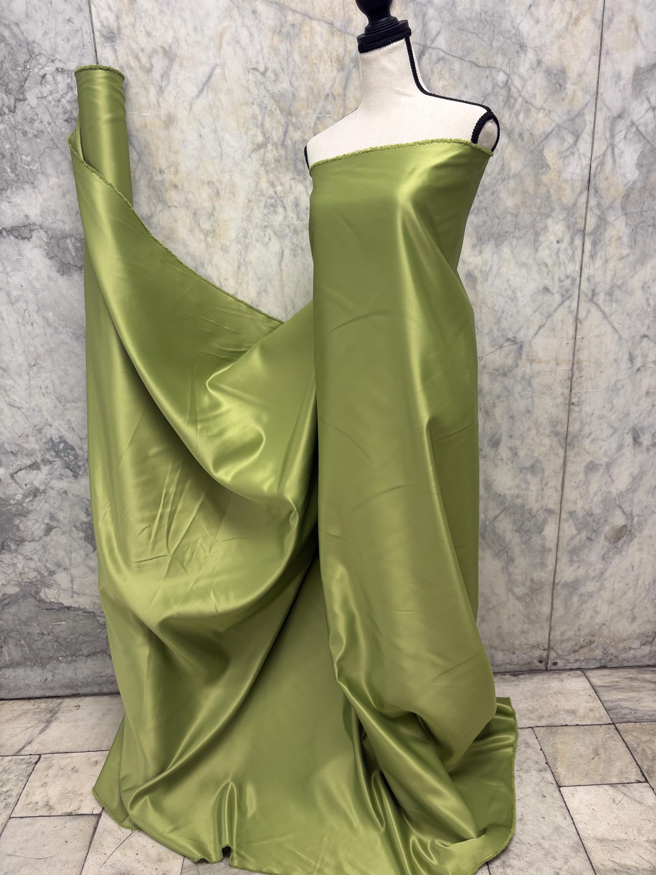 Green dull satin fabric, 58/60” wide, made of polyester – an excellent choice for gowns.