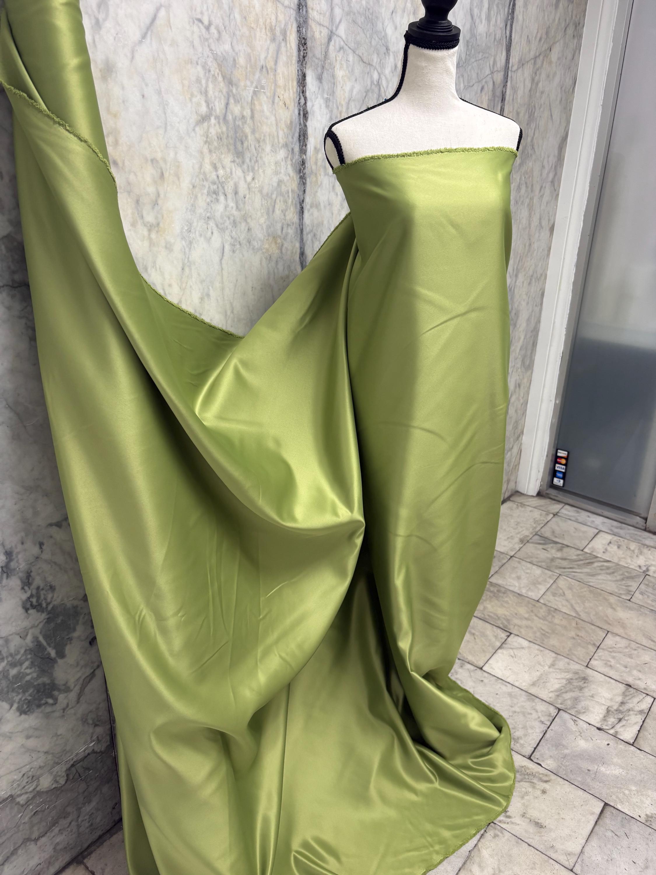 Green dull satin fabric, 58/60” wide, made of polyester – an excellent choice for gowns.