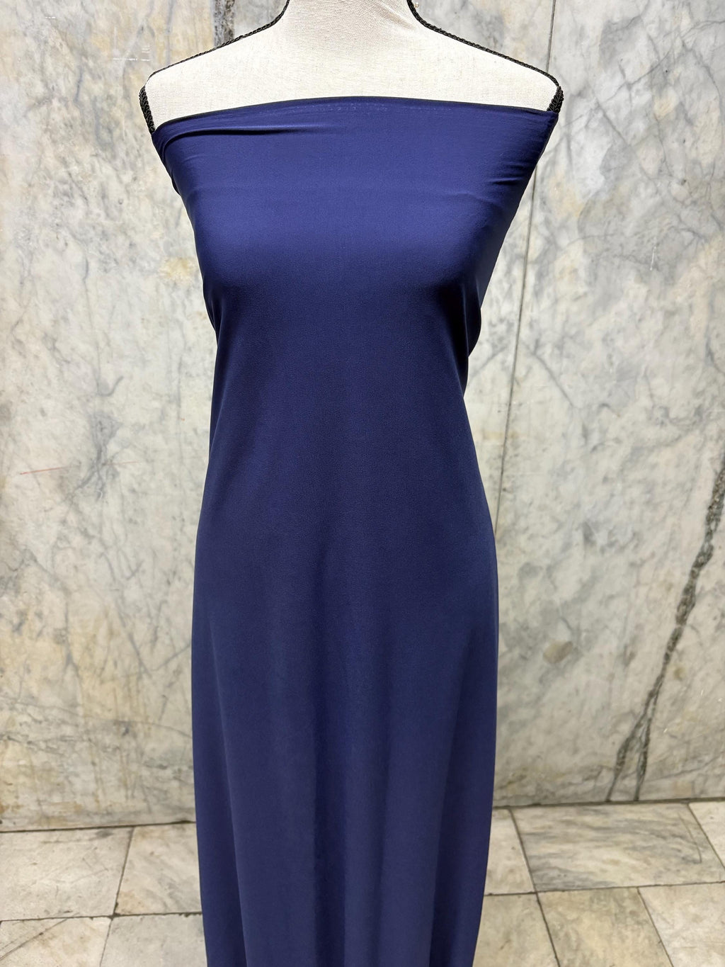Navy ITY spandex fabric is an excellent choice for evening wear, known for its smooth texture and elegant drape. Sell by 1 yard increment.