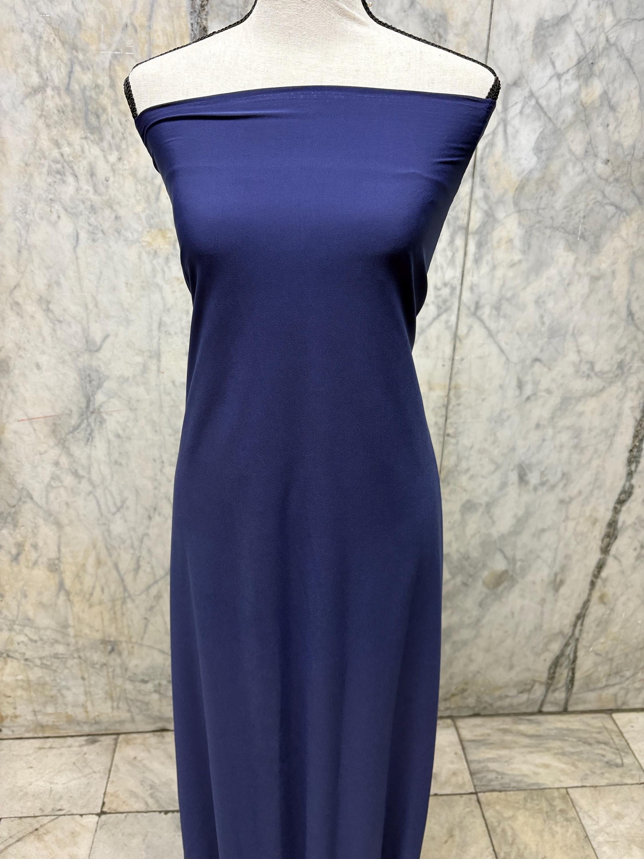 Navy ITY spandex fabric is an excellent choice for evening wear, known for its smooth texture and elegant drape. Sell by 1 yard increment.