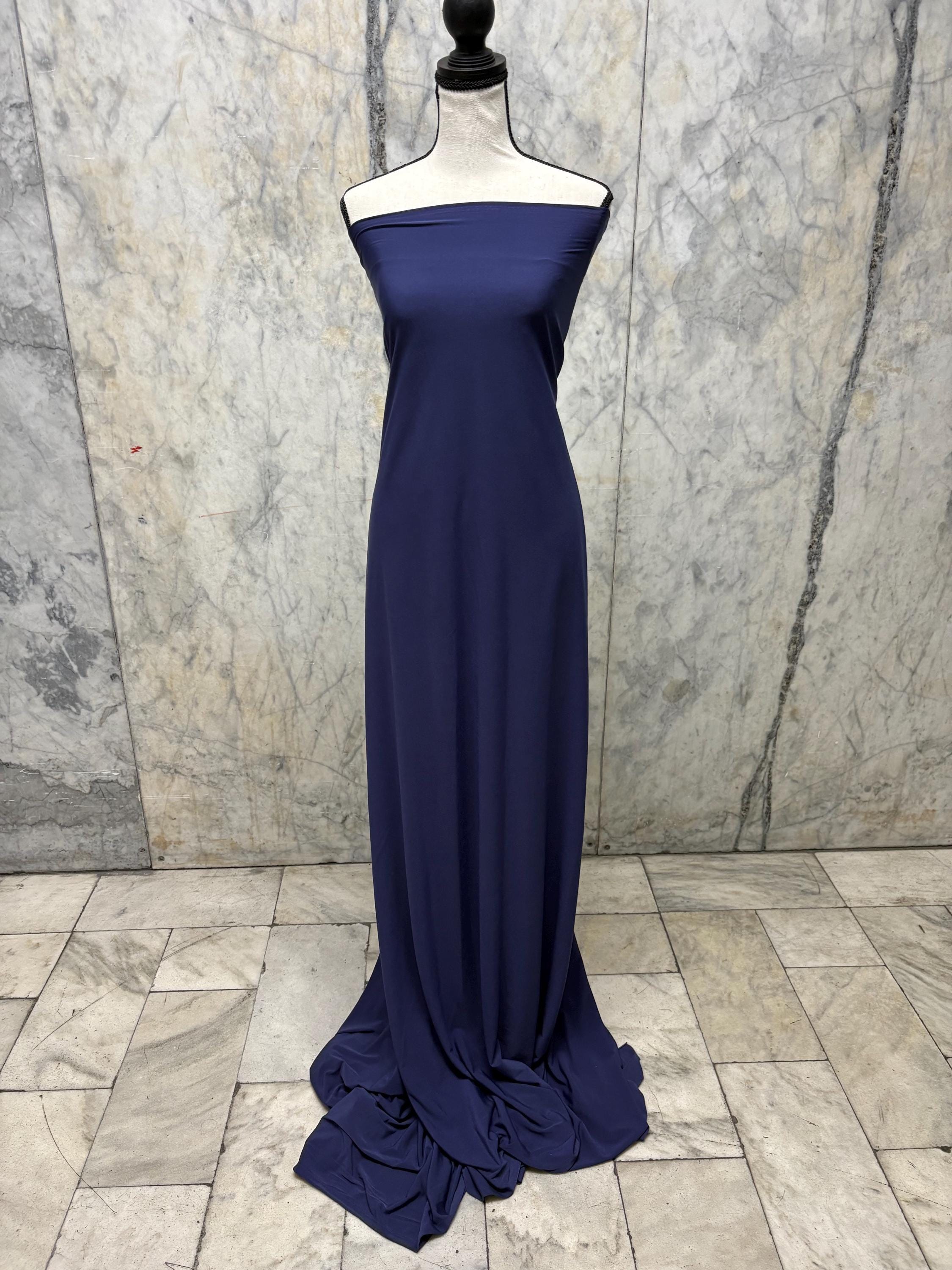Navy ITY spandex fabric is an excellent choice for evening wear, known for its smooth texture and elegant drape. Sell by 1 yard increment.