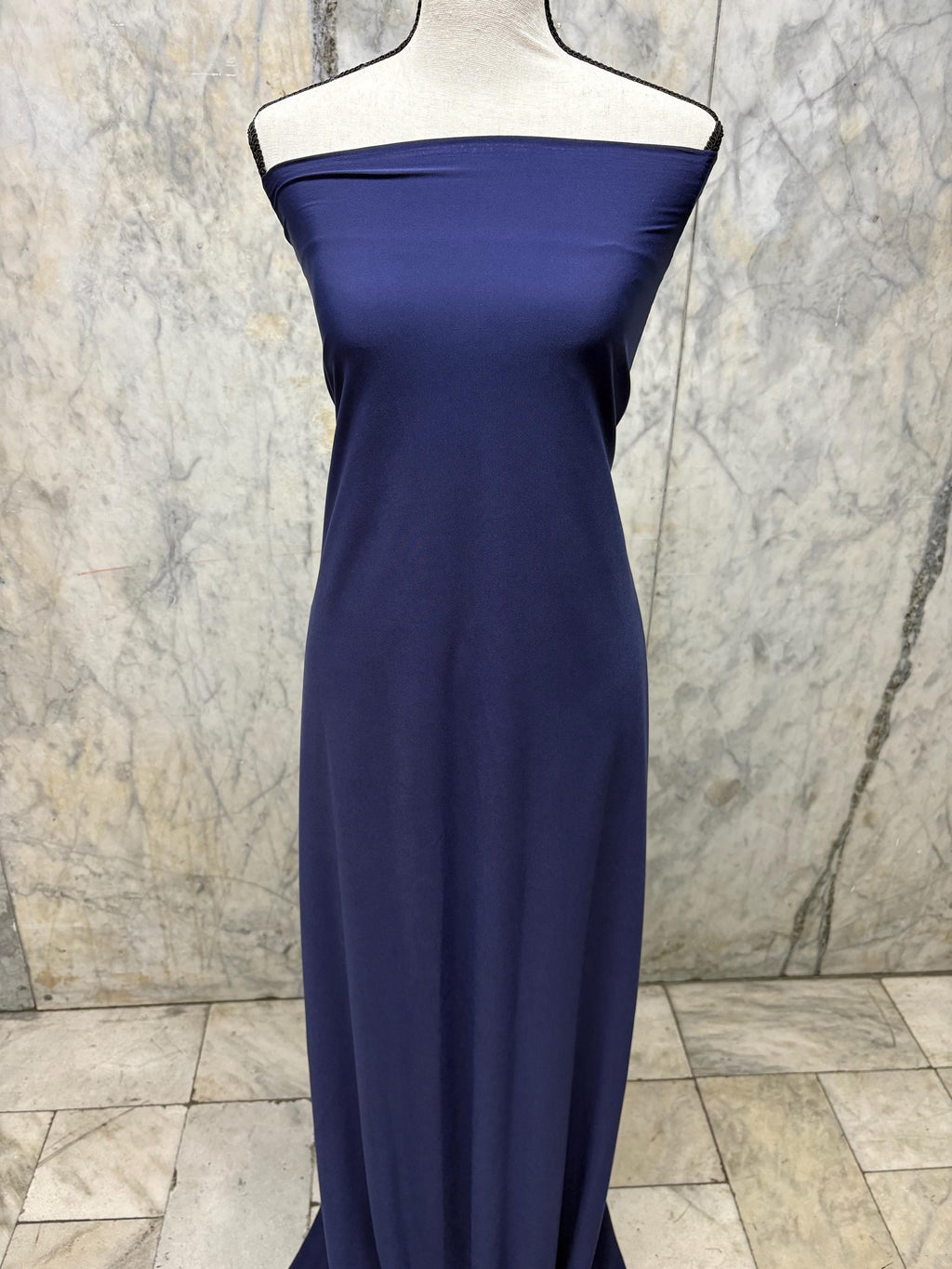 Navy ITY spandex fabric is an excellent choice for evening wear, known for its smooth texture and elegant drape. Sell by 1 yard increment.