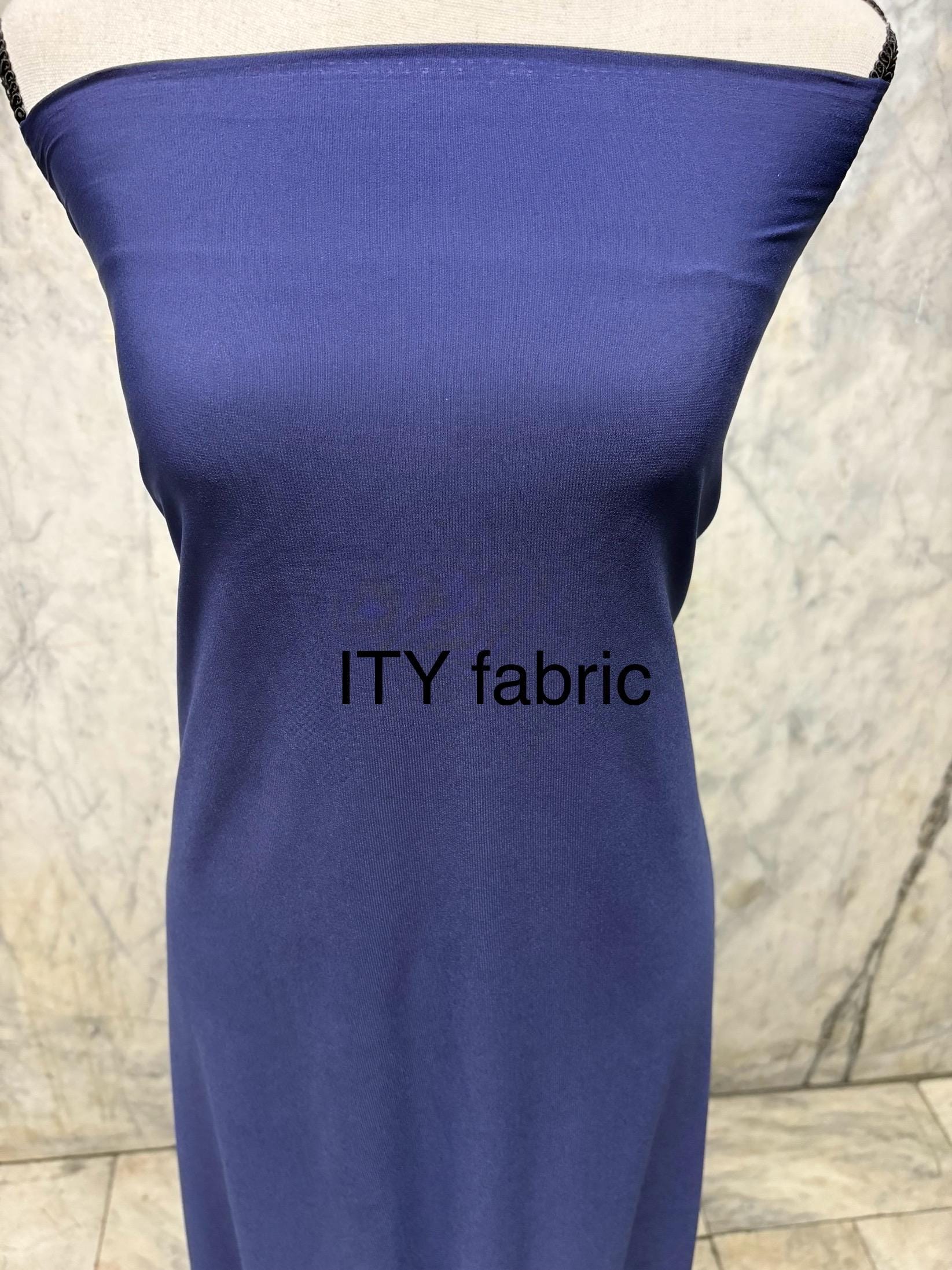 Navy ITY spandex fabric is an excellent choice for evening wear, known for its smooth texture and elegant drape. Sell by 1 yard increment.