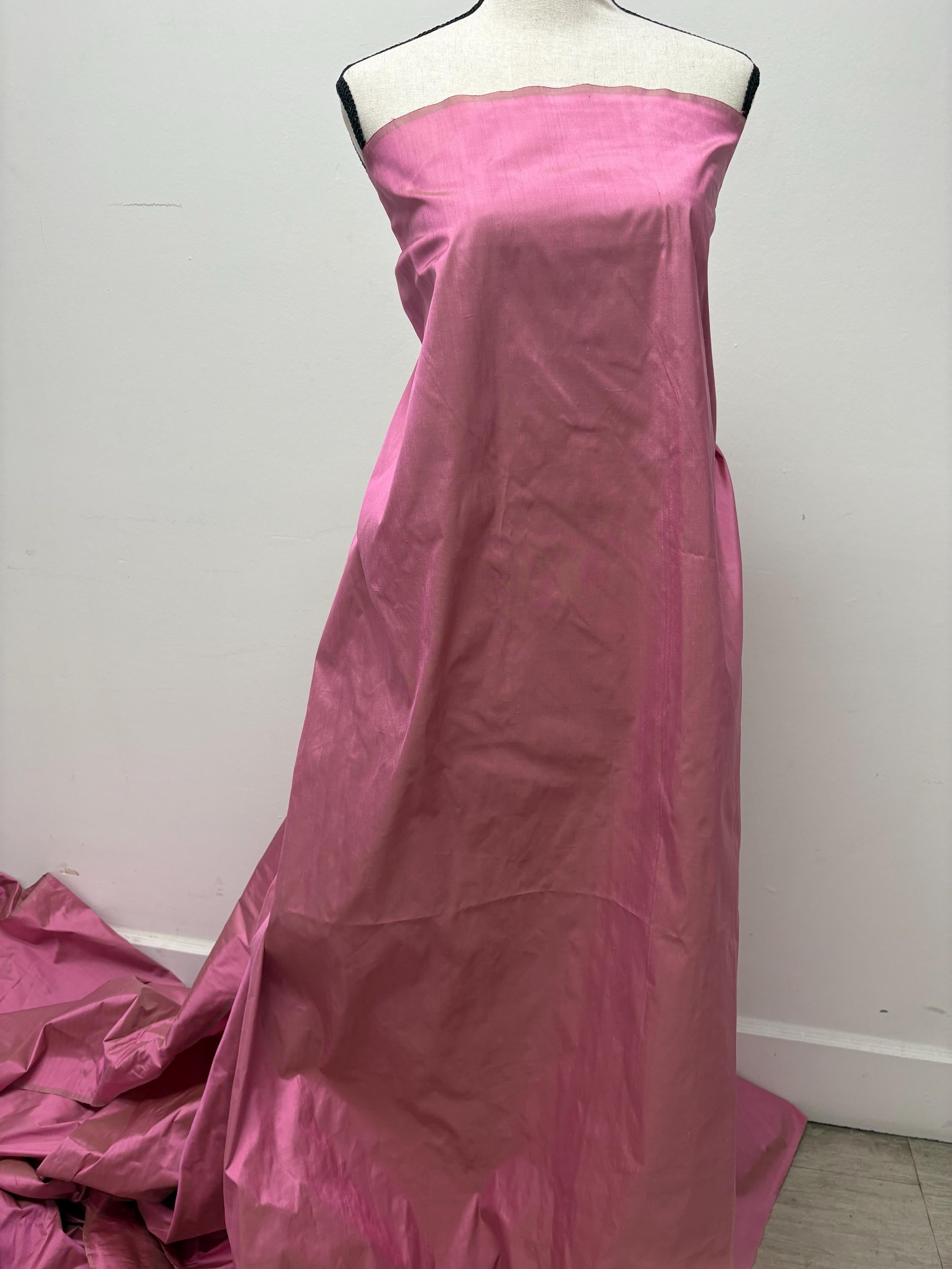 100% silk Dupioni Taffeta width 54" color Dusty Rose with green sheen. Fabric has slubbed. Check description. Item # 2259-2. NAS.