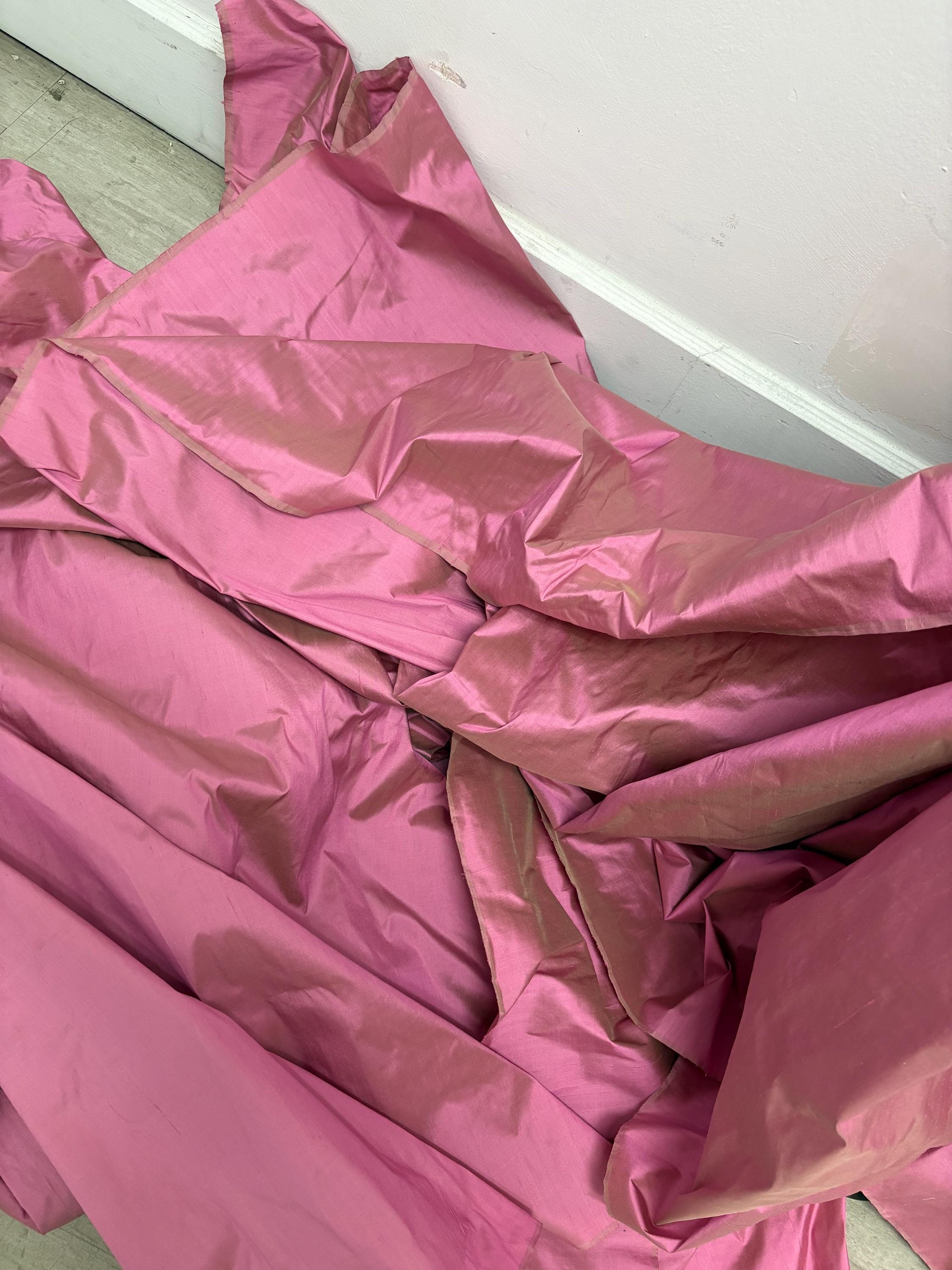 100% silk Dupioni Taffeta width 54" color Dusty Rose with green sheen. Fabric has slubbed. Check description. Item # 2259-2. NAS.