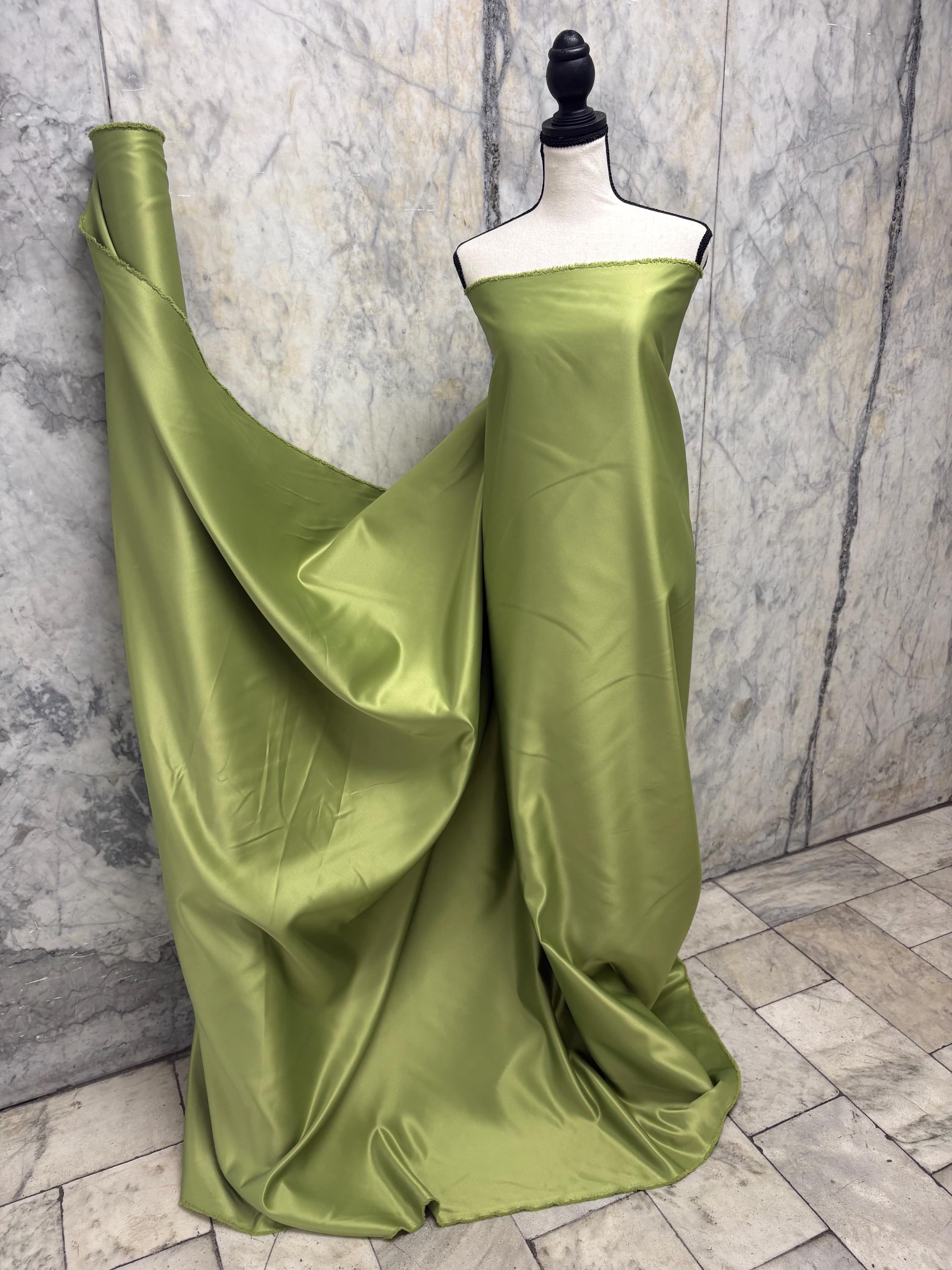 Green dull satin fabric, 58/60” wide, made of polyester – an excellent choice for gowns.
