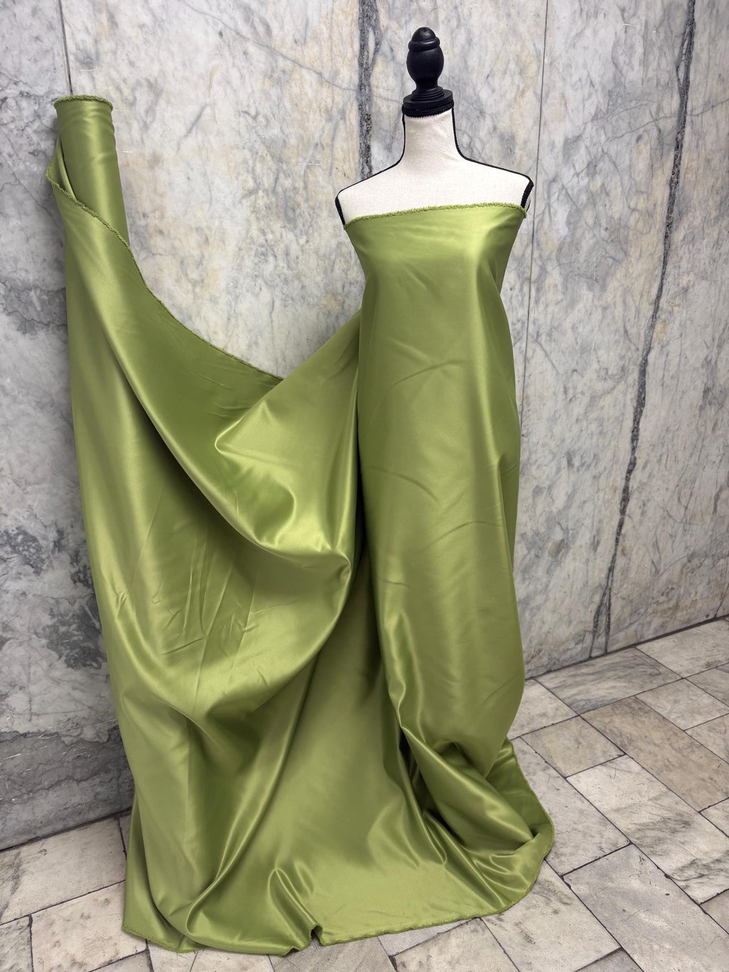 Green dull satin fabric, 58/60” wide, made of polyester – an excellent choice for gowns.