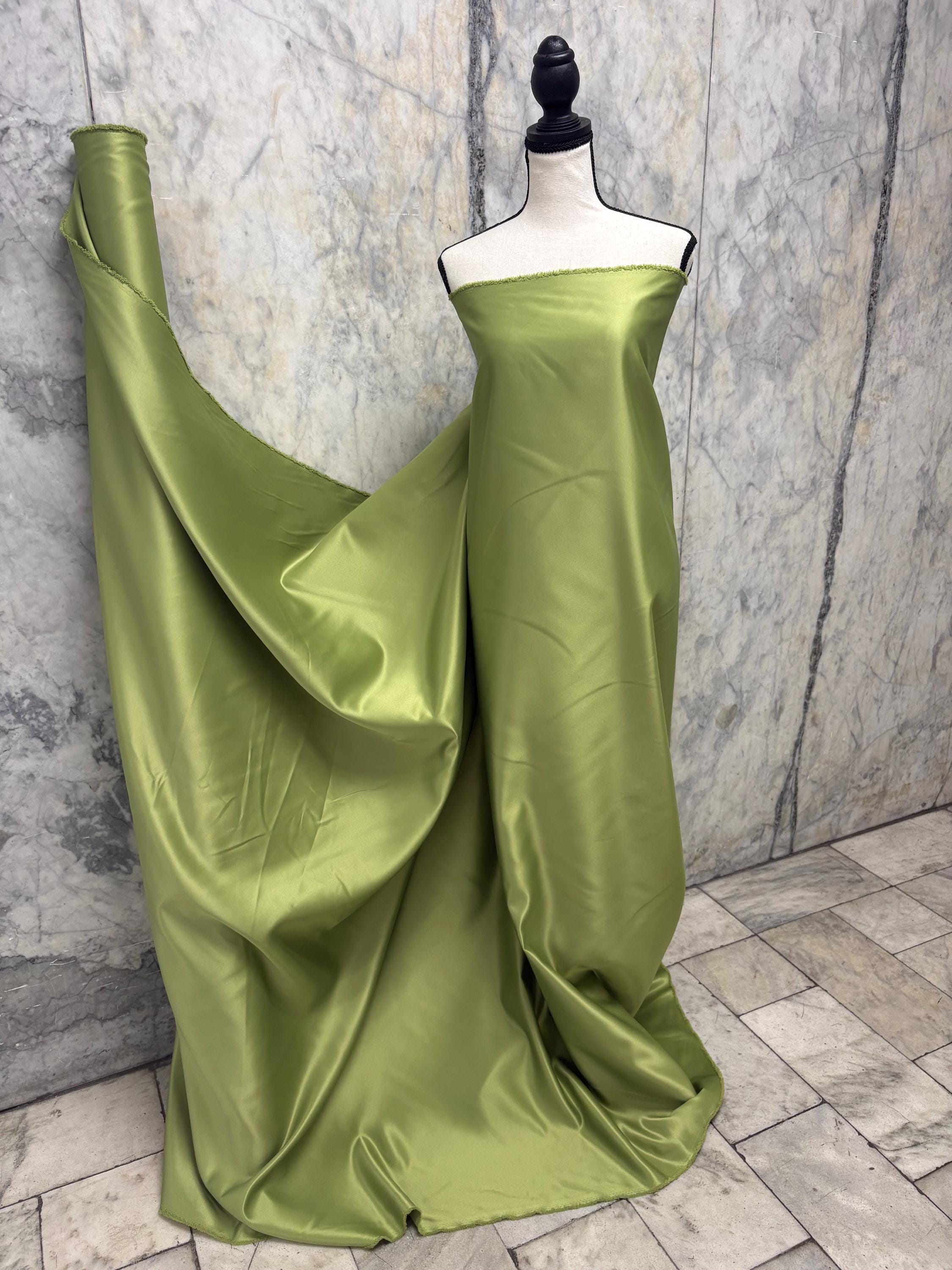 Green dull satin fabric, 58/60” wide, made of polyester – an excellent choice for gowns.