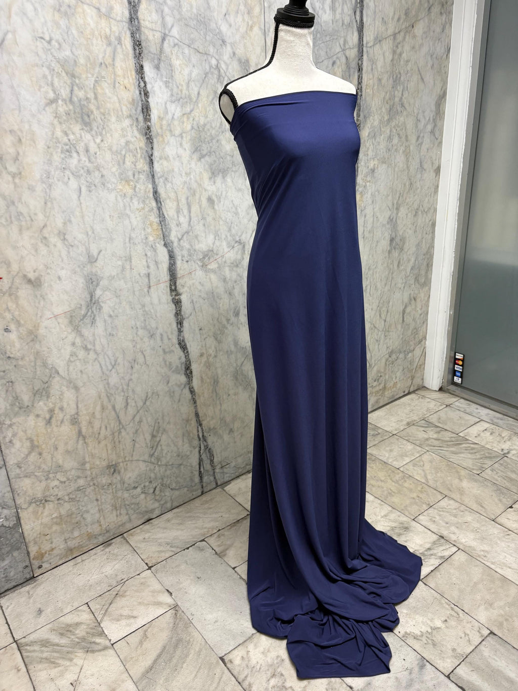 Navy ITY spandex fabric is an excellent choice for evening wear, known for its smooth texture and elegant drape. Sell by 1 yard increment.