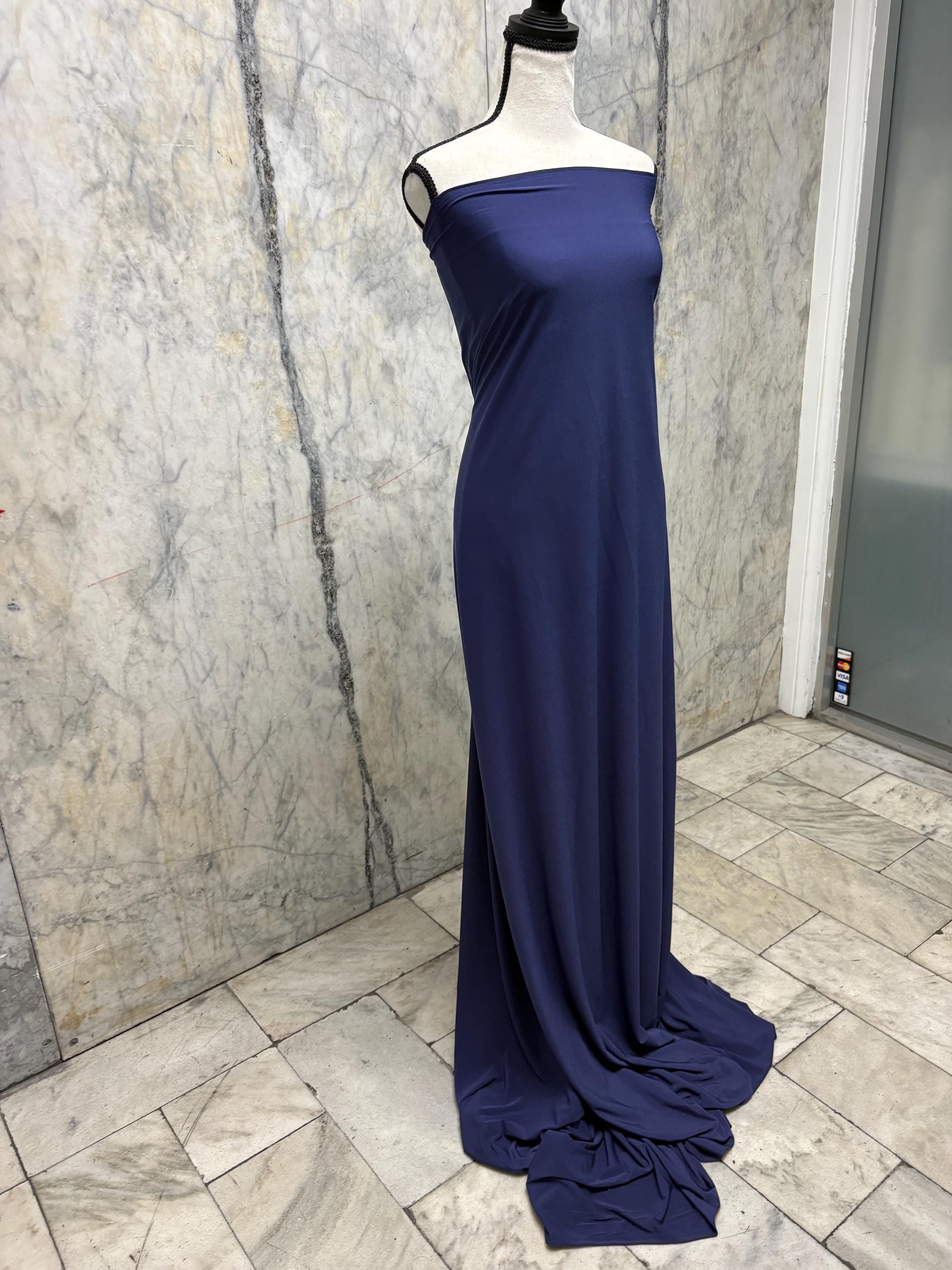Navy ITY spandex fabric is an excellent choice for evening wear, known for its smooth texture and elegant drape. Sell by 1 yard increment.