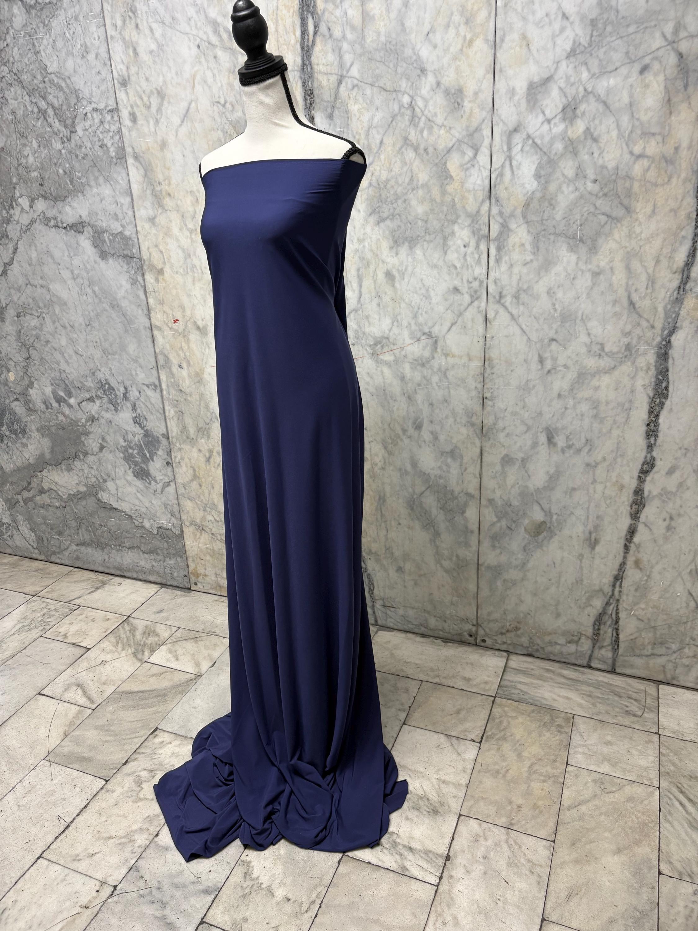 Navy ITY spandex fabric is an excellent choice for evening wear, known for its smooth texture and elegant drape. Sell by 1 yard increment.