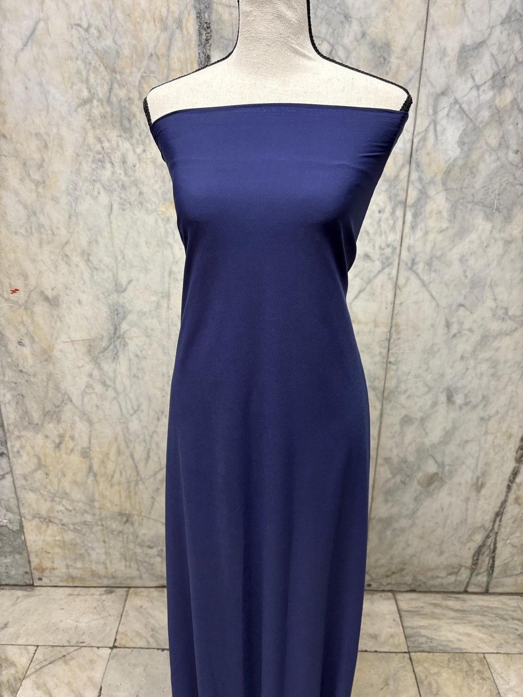 Navy ITY spandex fabric is an excellent choice for evening wear, known for its smooth texture and elegant drape. Sell by 1 yard increment.
