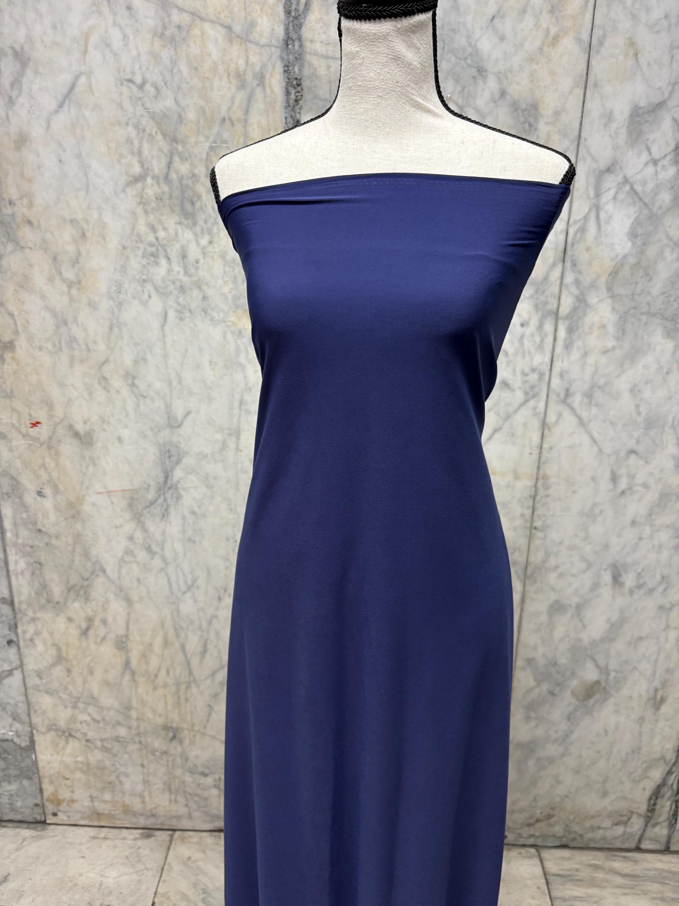 Navy ITY spandex fabric is an excellent choice for evening wear, known for its smooth texture and elegant drape. Sell by 1 yard increment.