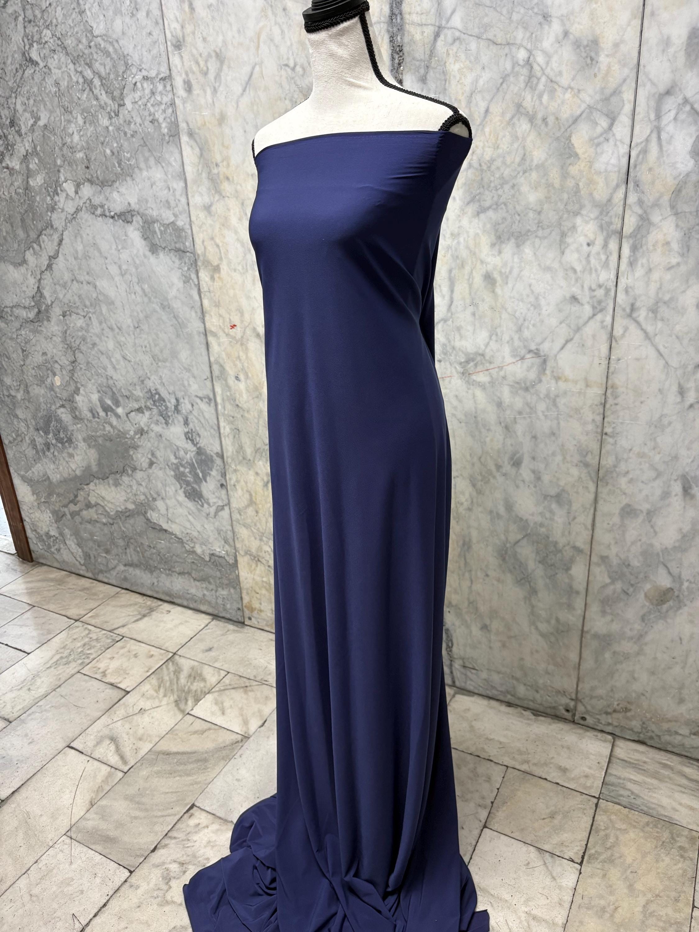 Navy ITY spandex fabric is an excellent choice for evening wear, known for its smooth texture and elegant drape. Sell by 1 yard increment.