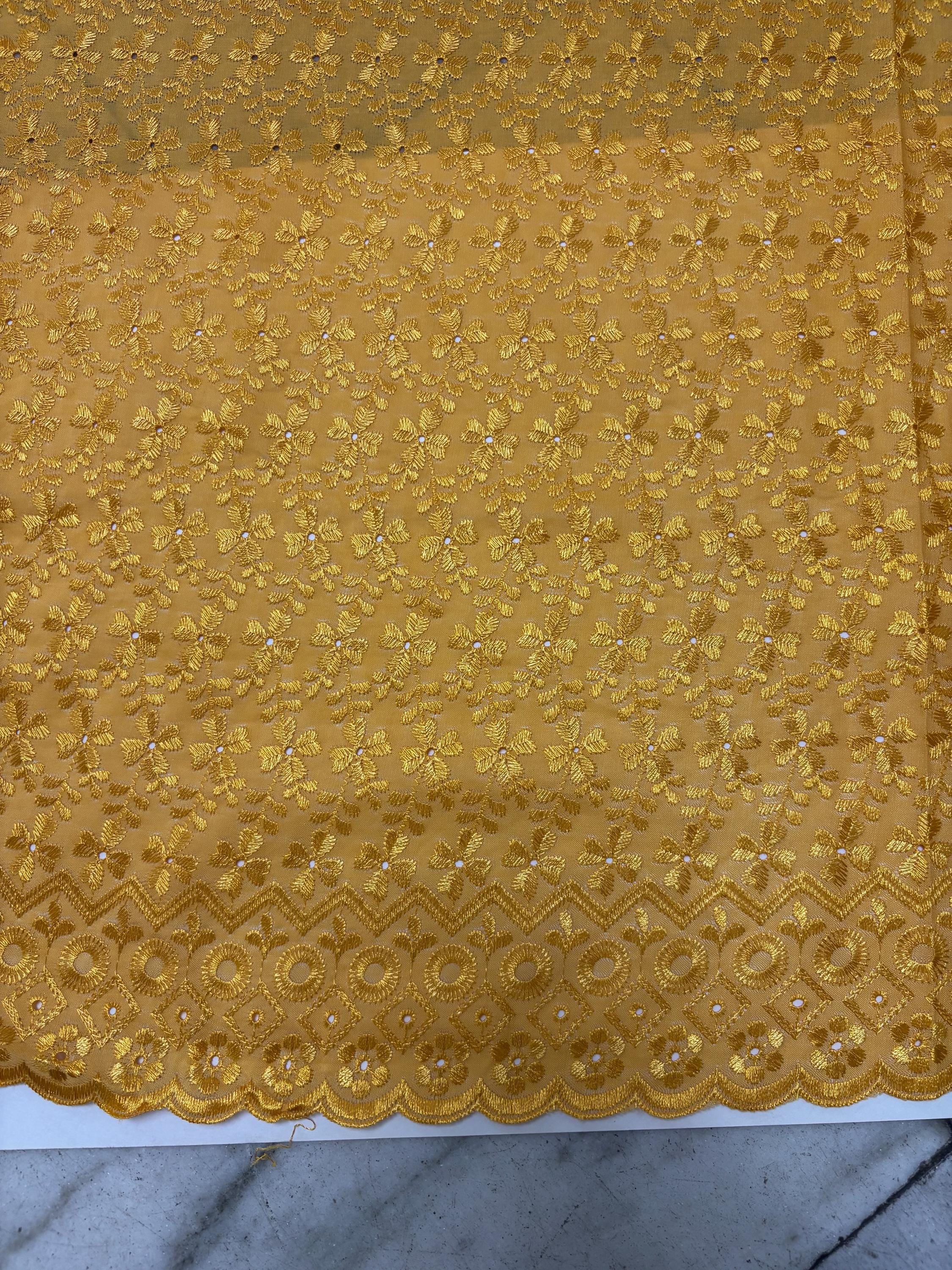 Eyelet fabric made of poly-cotton with all-over embroidery and double scalloped edges for a delicate finish. color Gold design # 2
