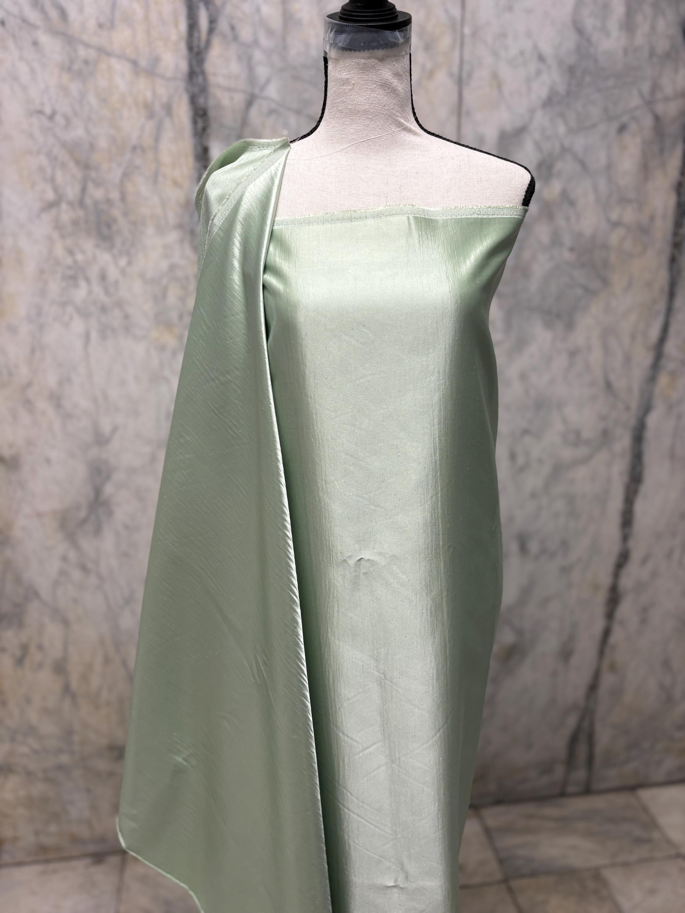 A 2 3/4 yards cut fabric satin shantung color Lt. sage, double sided fabric width 58 inch. polyester