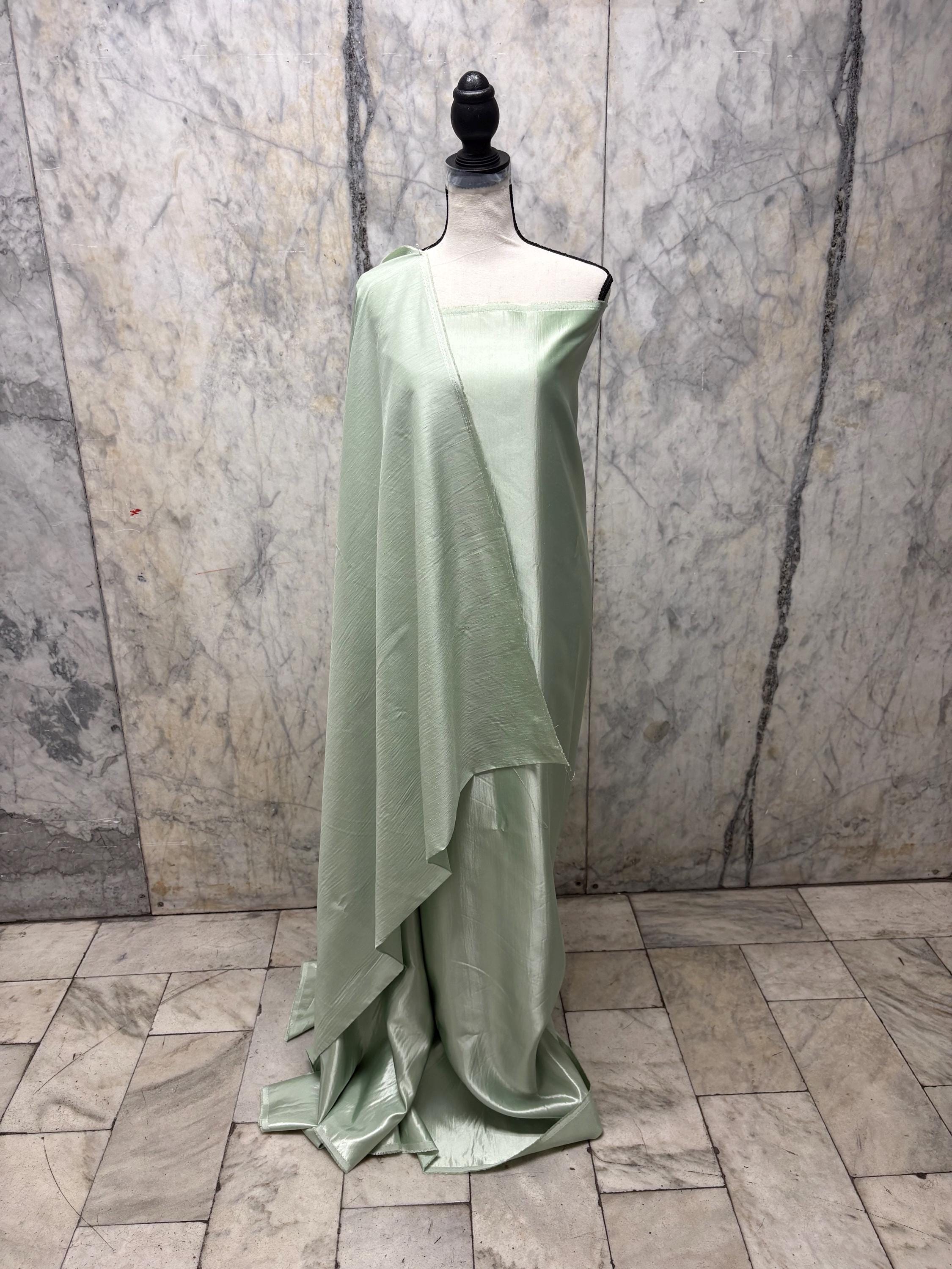 A 2 3/4 yards cut fabric satin shantung color Lt. sage, double sided fabric width 58 inch. polyester